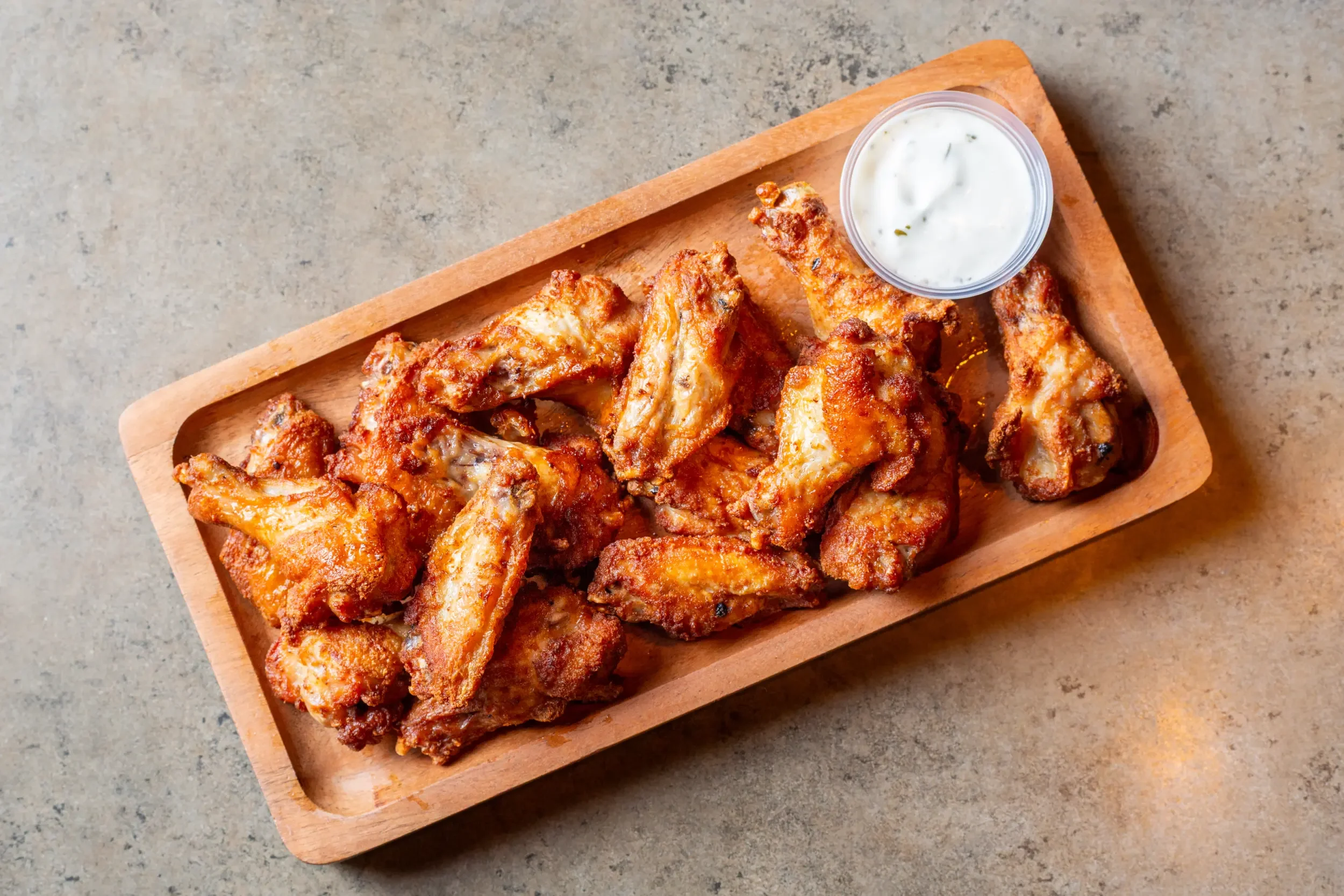Crispy buffalo chicken wings served with ranch dressing
