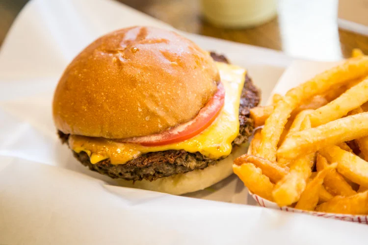 Classic American cheeseburger with fries