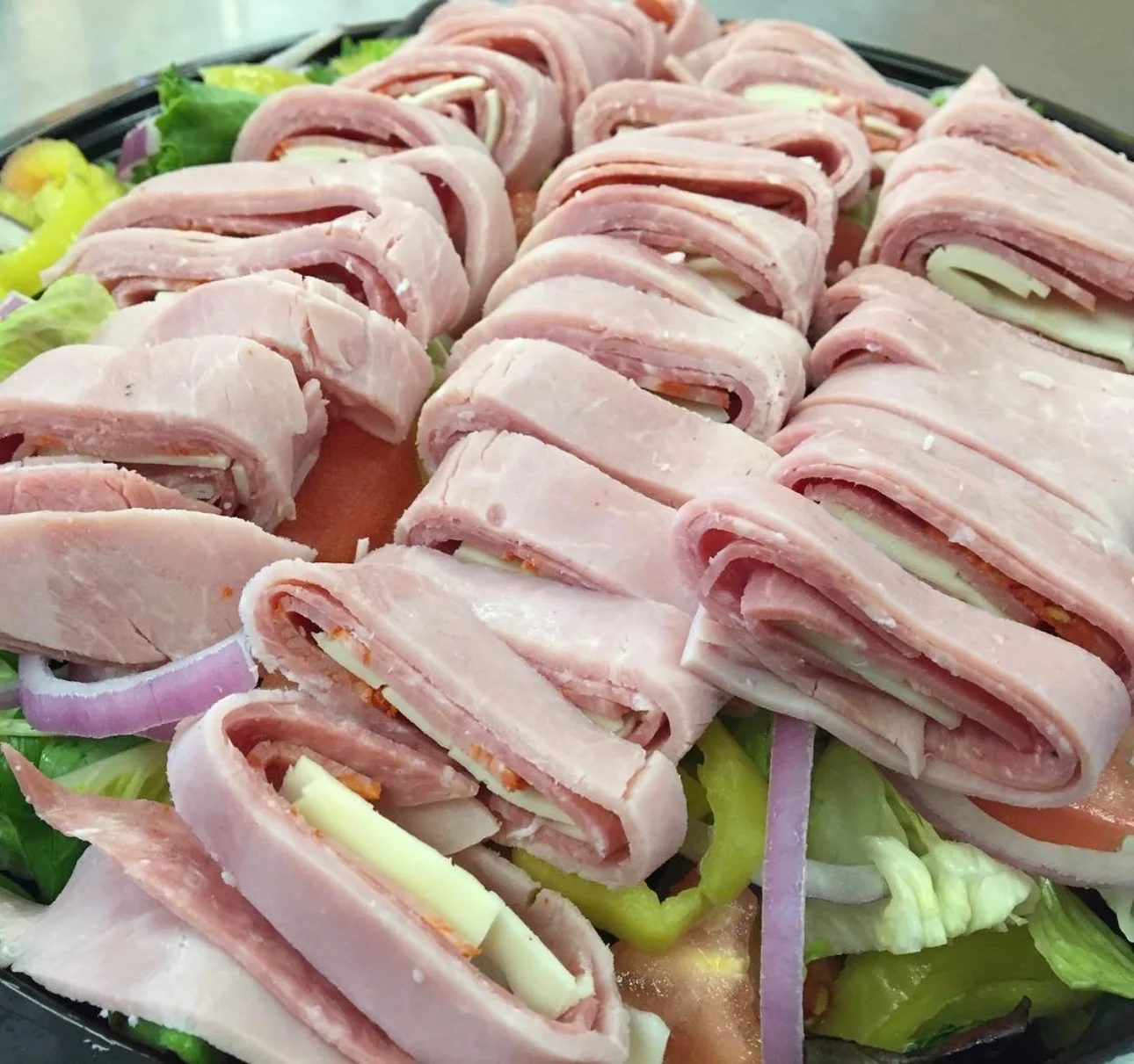 Italian antipasto platter with rolled ham and cheese