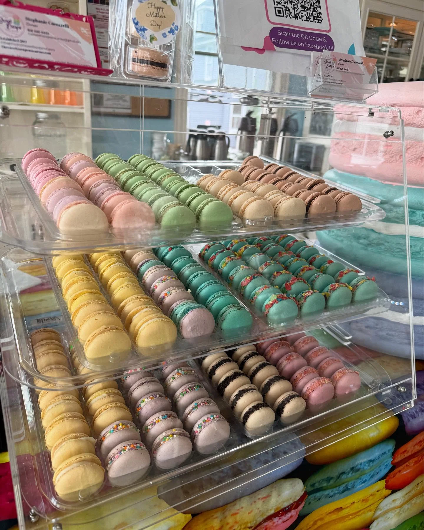 Colorful display of French macarons in various flavors