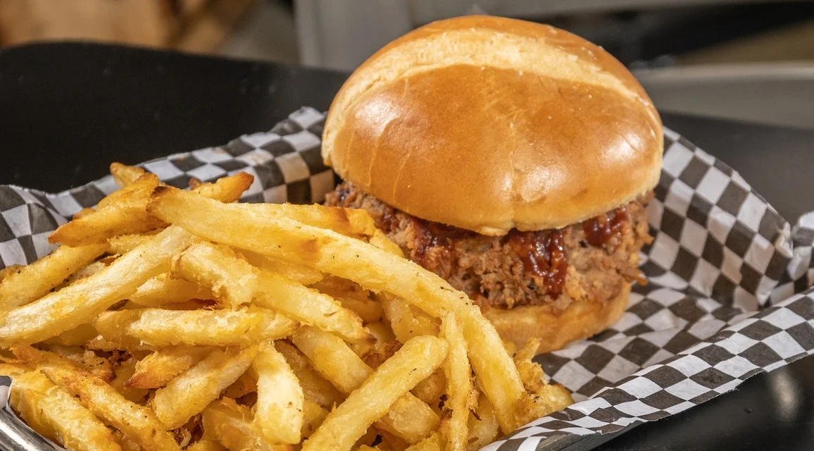 Delicious pulled pork sandwich with coleslaw on a bun
