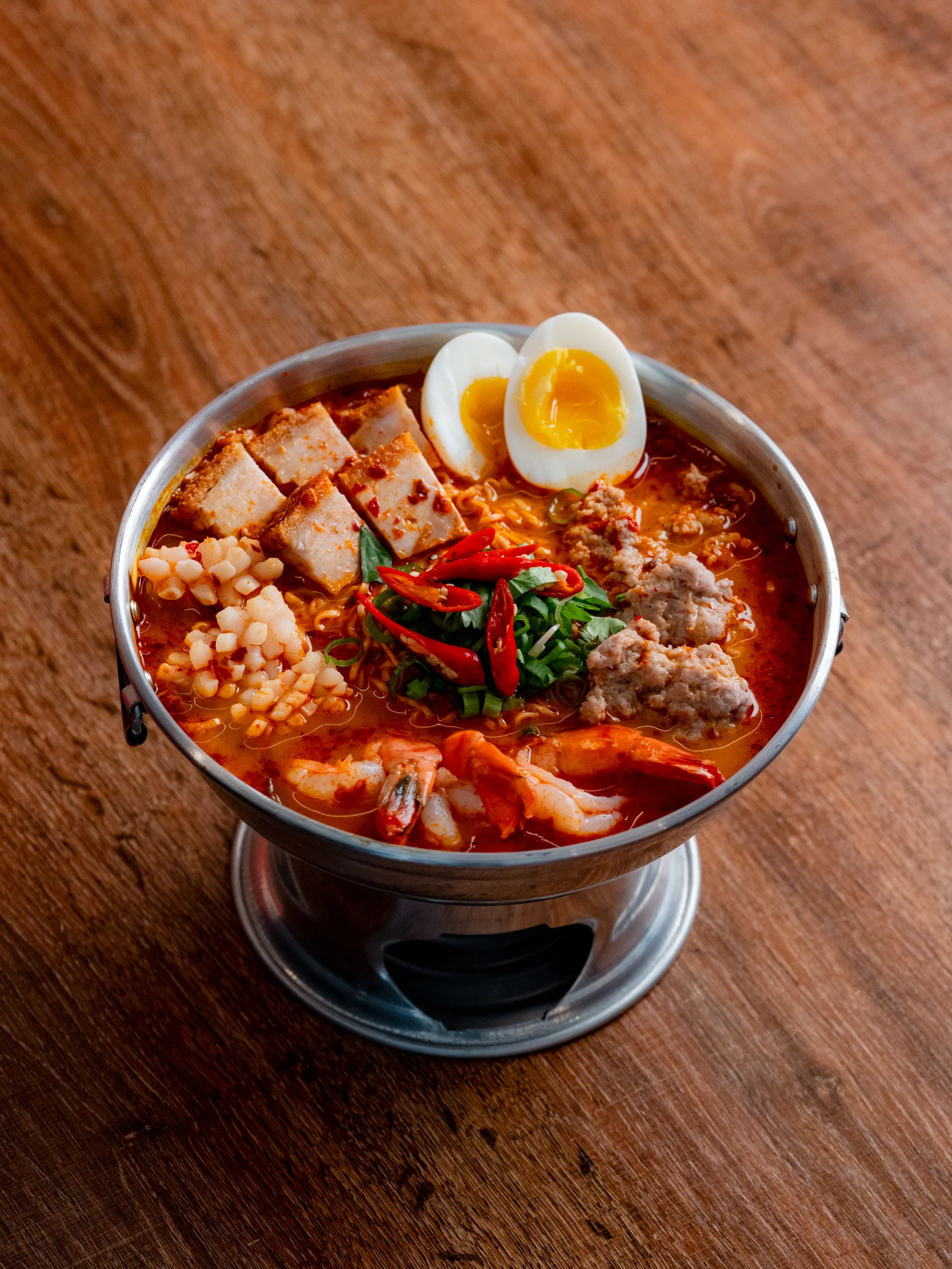 Spicy Thai tom yum noodle soup with seafood