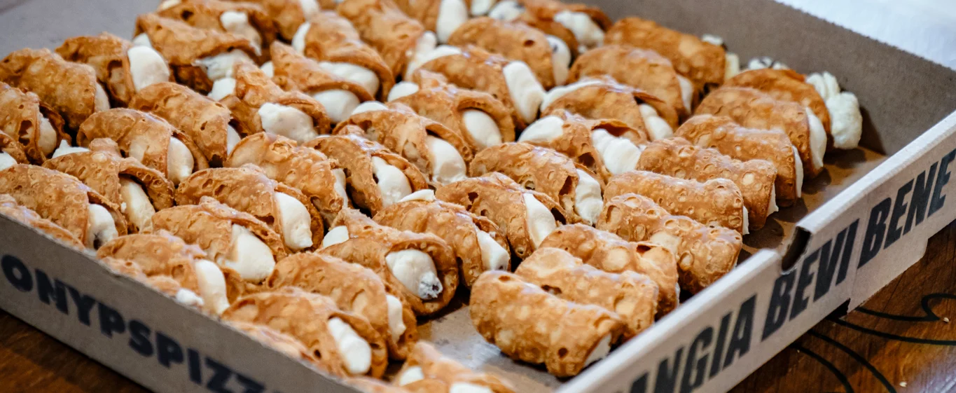 Box of Italian cannoli desserts ready to serve
