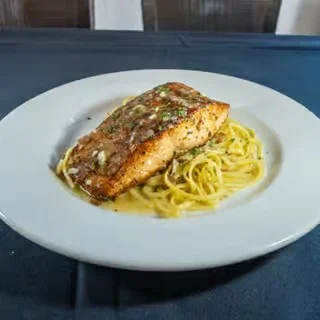 Grilled salmon over garlic linguine