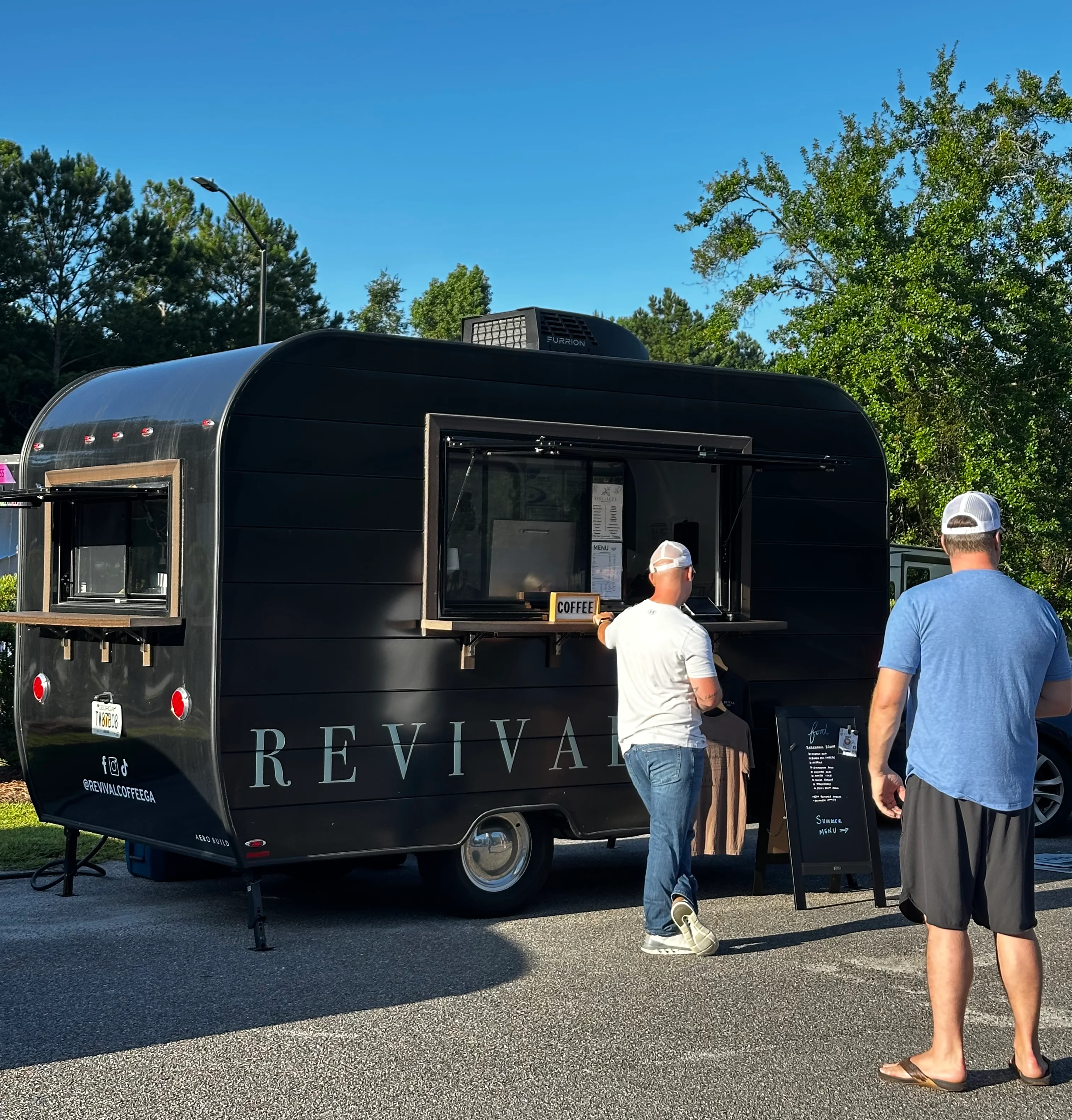 Revival Coffee branded mobile trailer in Savannah Georgia with customers lined up.