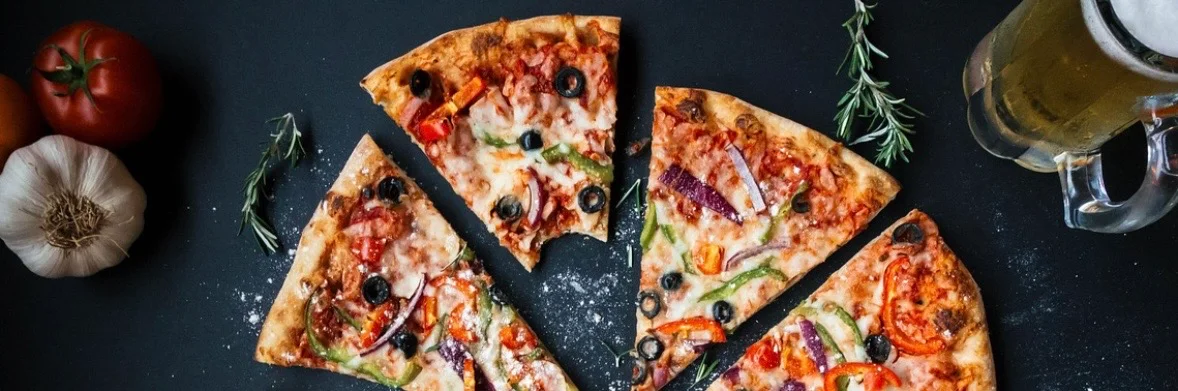 Delicious pepperoni pizza slices on a dark background