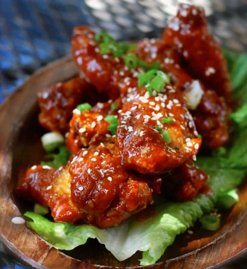 Korean fried chicken wings with sesame and green onions