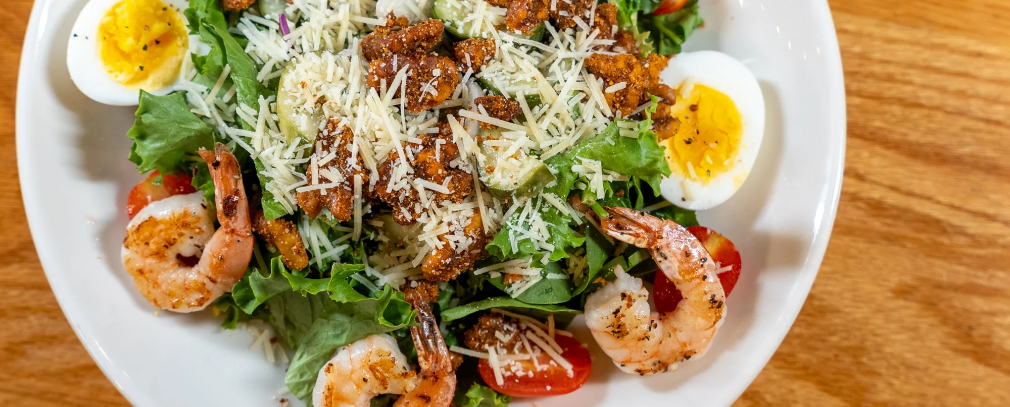 Shrimp salad with hard-boiled eggs and parmesan cheese