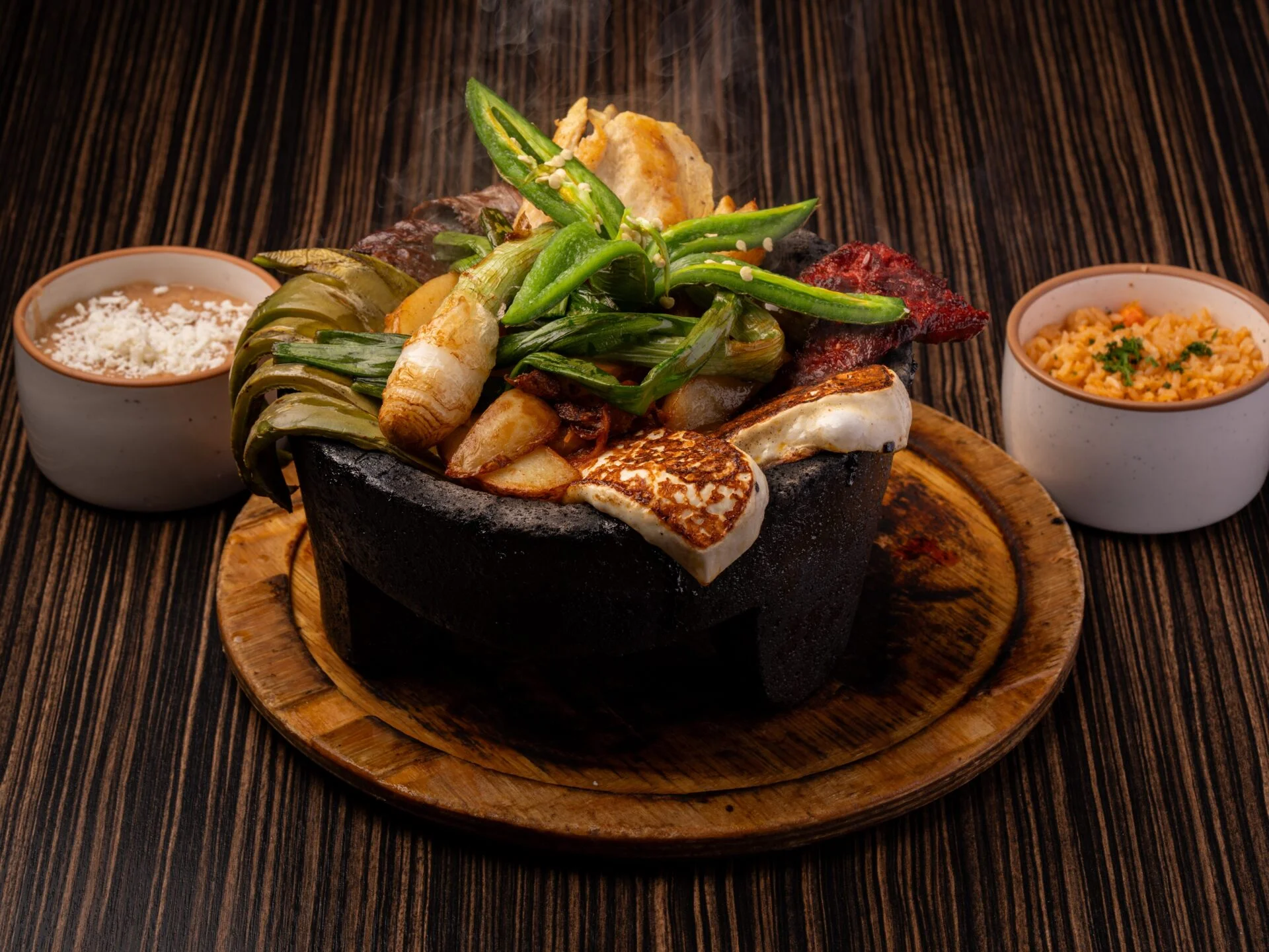 Sizzling Mexican fajitas served in a stone bowl