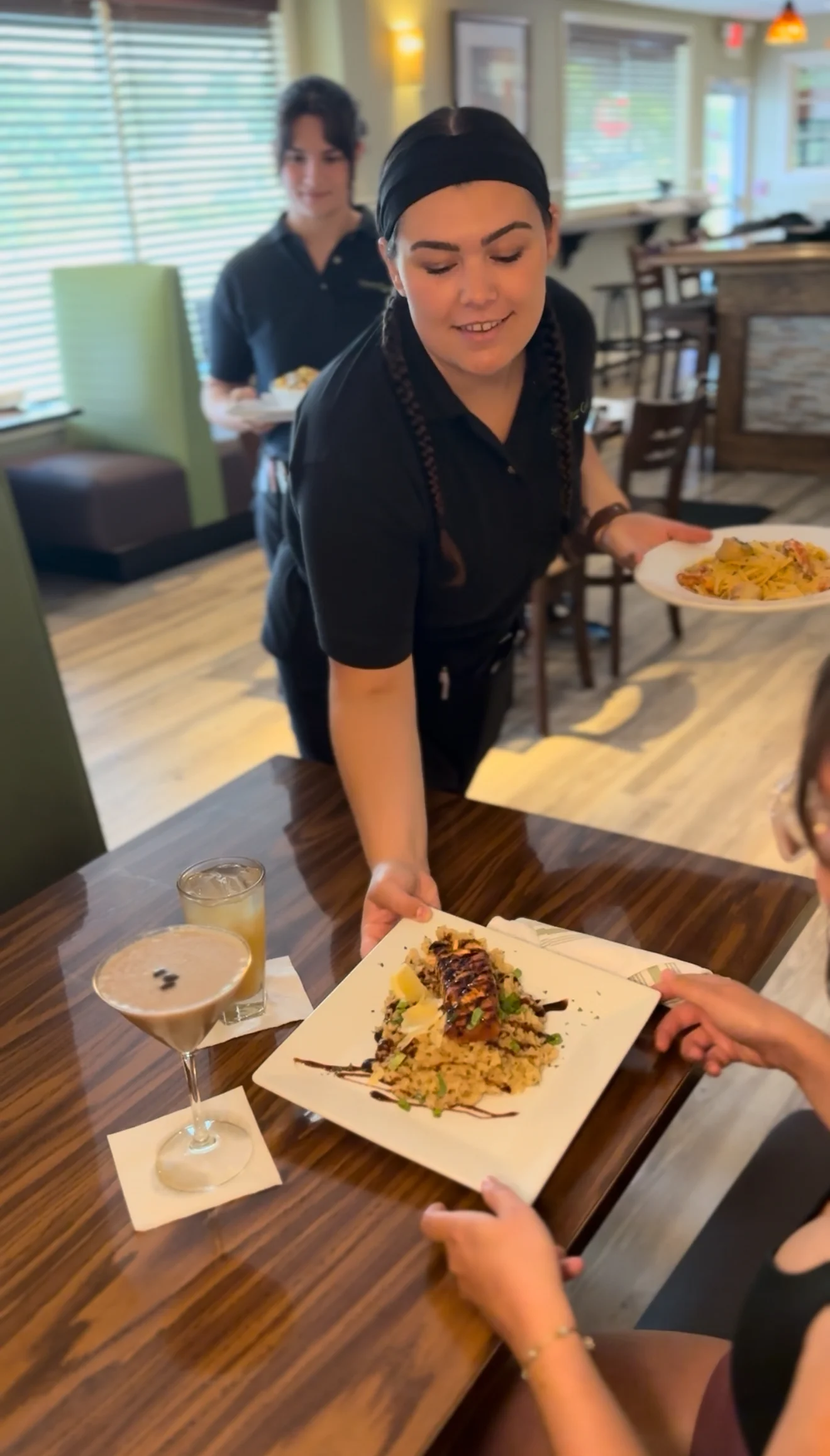 Plated grilled salmon with rice and garnish in a restaurant setting
