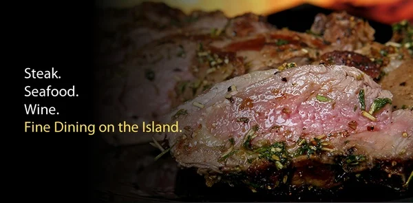 Juicy steak with herbs, showcasing fine dining on the island