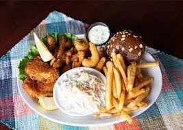 Southern fried seafood platter with fries and coleslaw