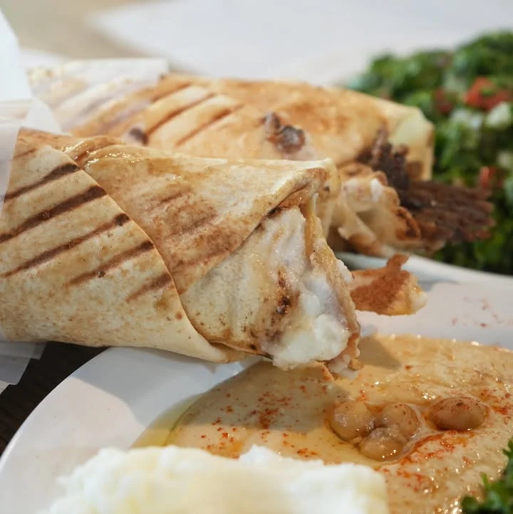Delicious shawarma wrap with grilled meat and sauces