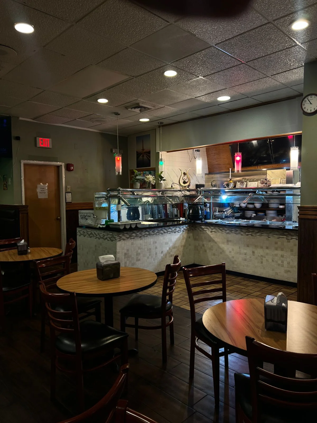 Cozy restaurant interior with buffet setup and warm lighting