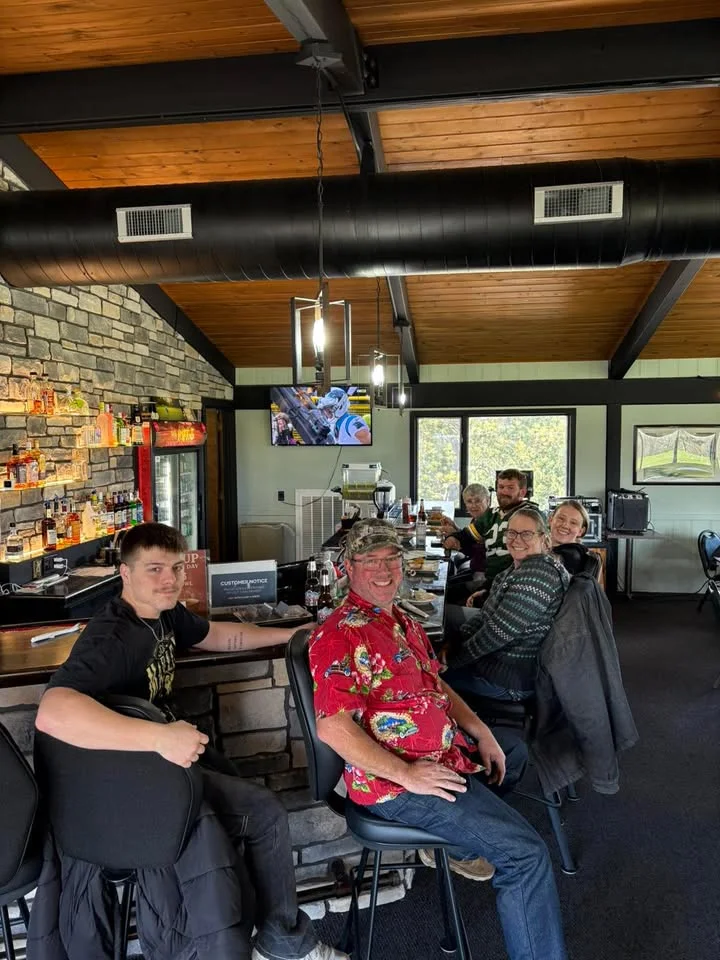 People Watching football at the bar 