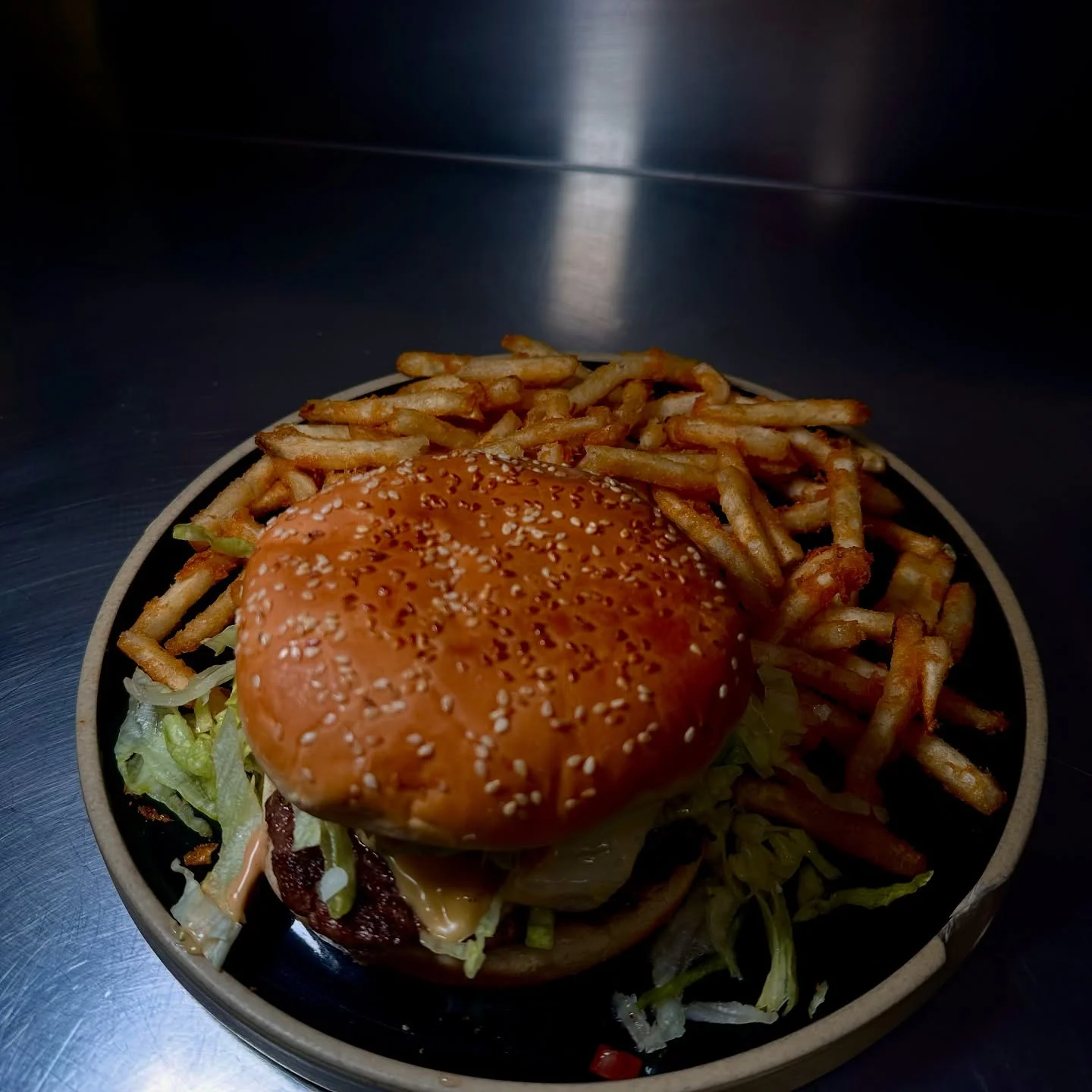 Classic American cheeseburger with fries