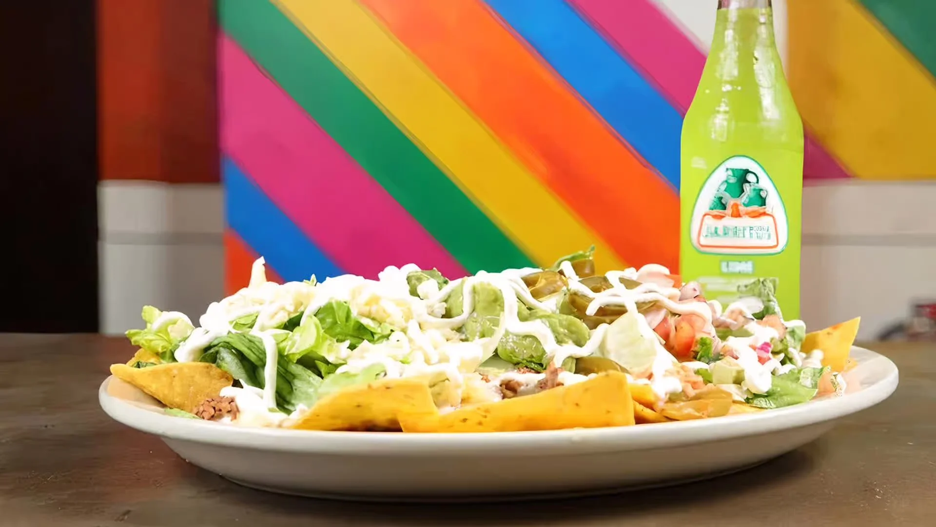 Plate of loaded nachos with toppings