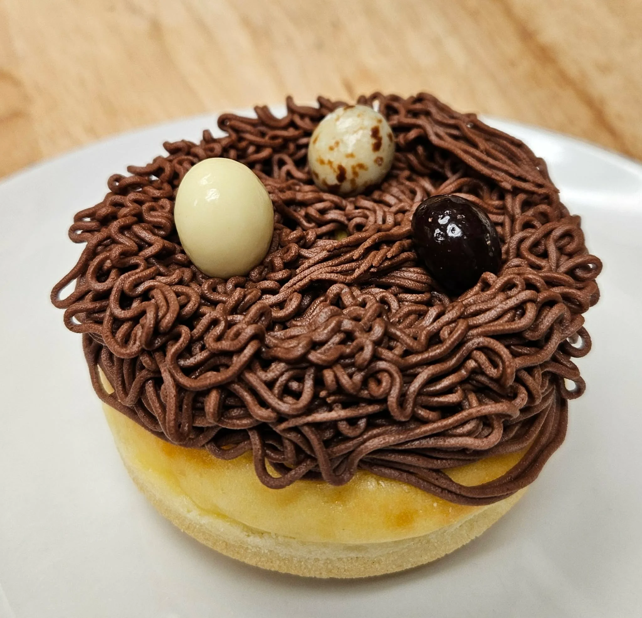 Eagle's Nest (baked donut, cheesecake, and cream cheese frosting, topped with 3 chocolate covered espresso beans)