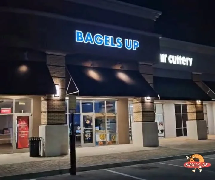 Exterior view of Bagels Up restaurant at night
