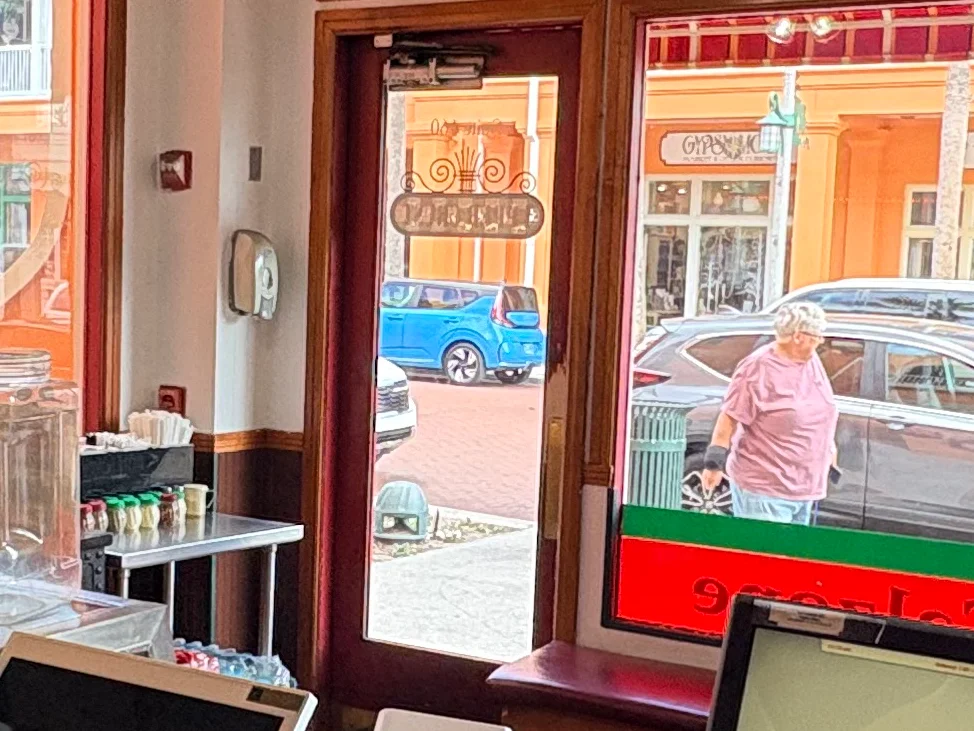 Pizza counter in a vibrant restaurant with fresh pies