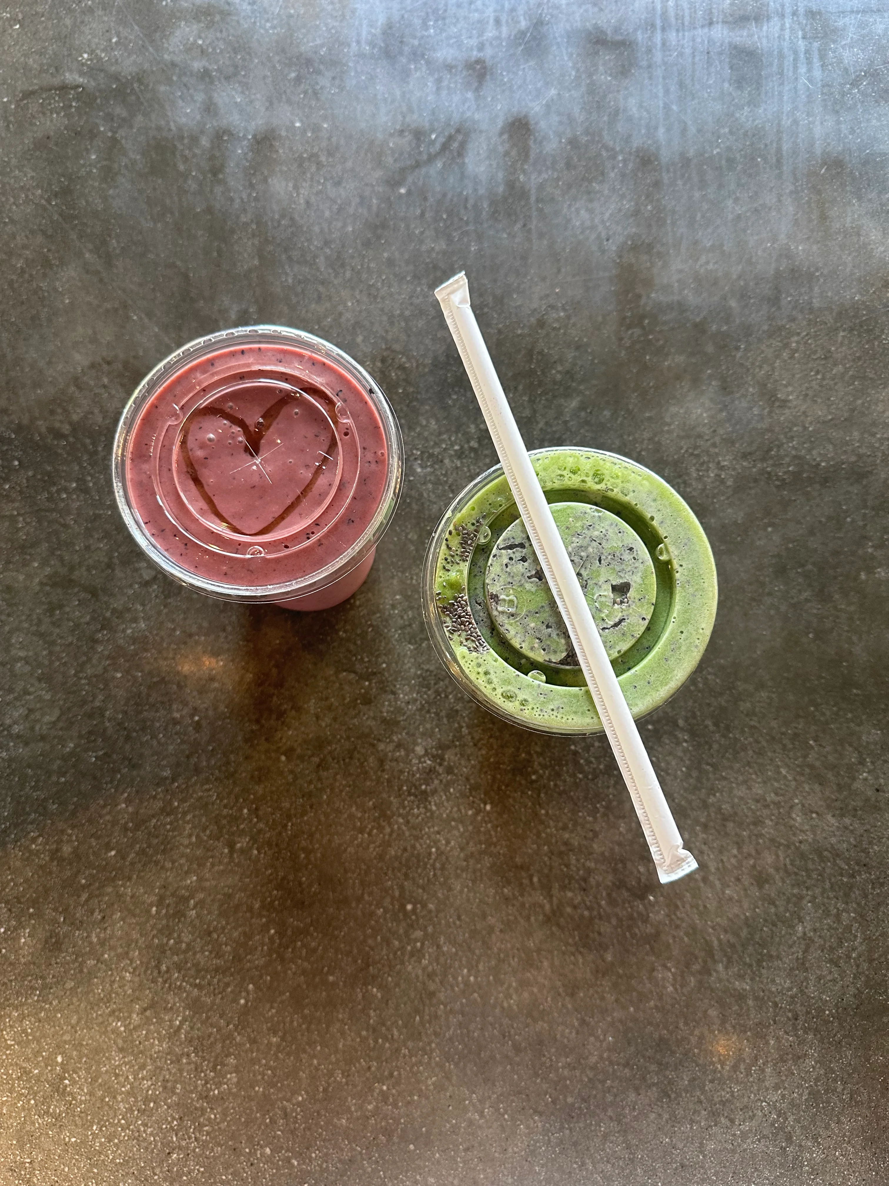 Refreshing smoothies with heart designs on top