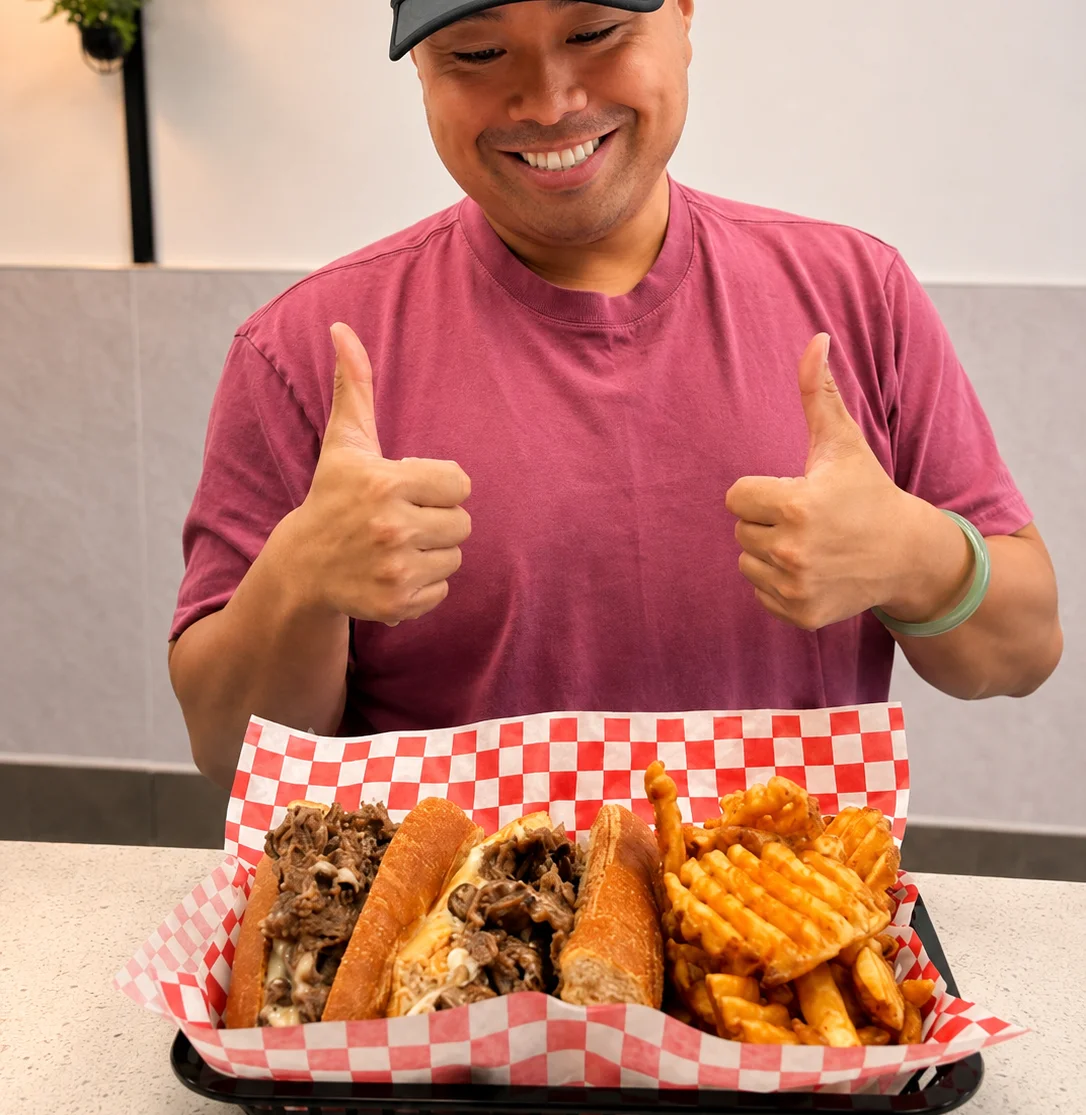 Delicious cheesesteak sandwiches with waffle fries
