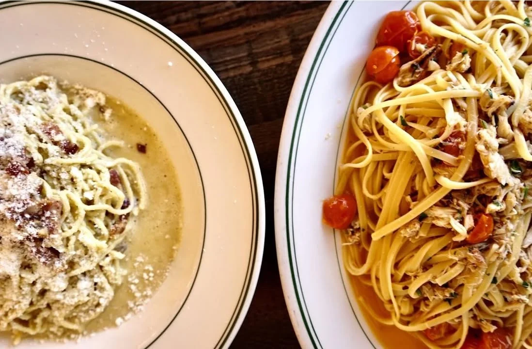 Italian pasta dishes featuring carbonara and linguine with crab