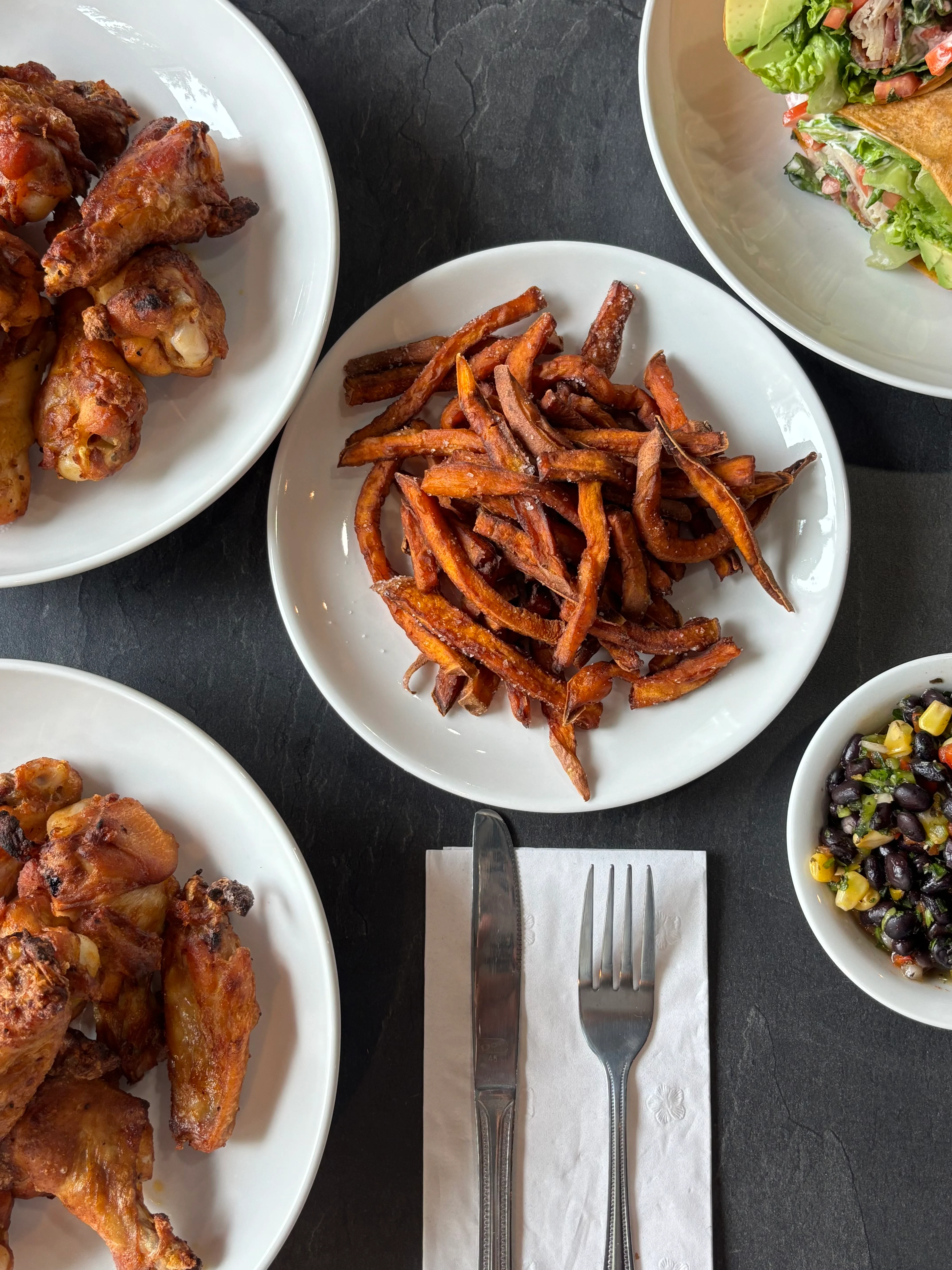 Crispy fried chicken wings with sweet potato fries