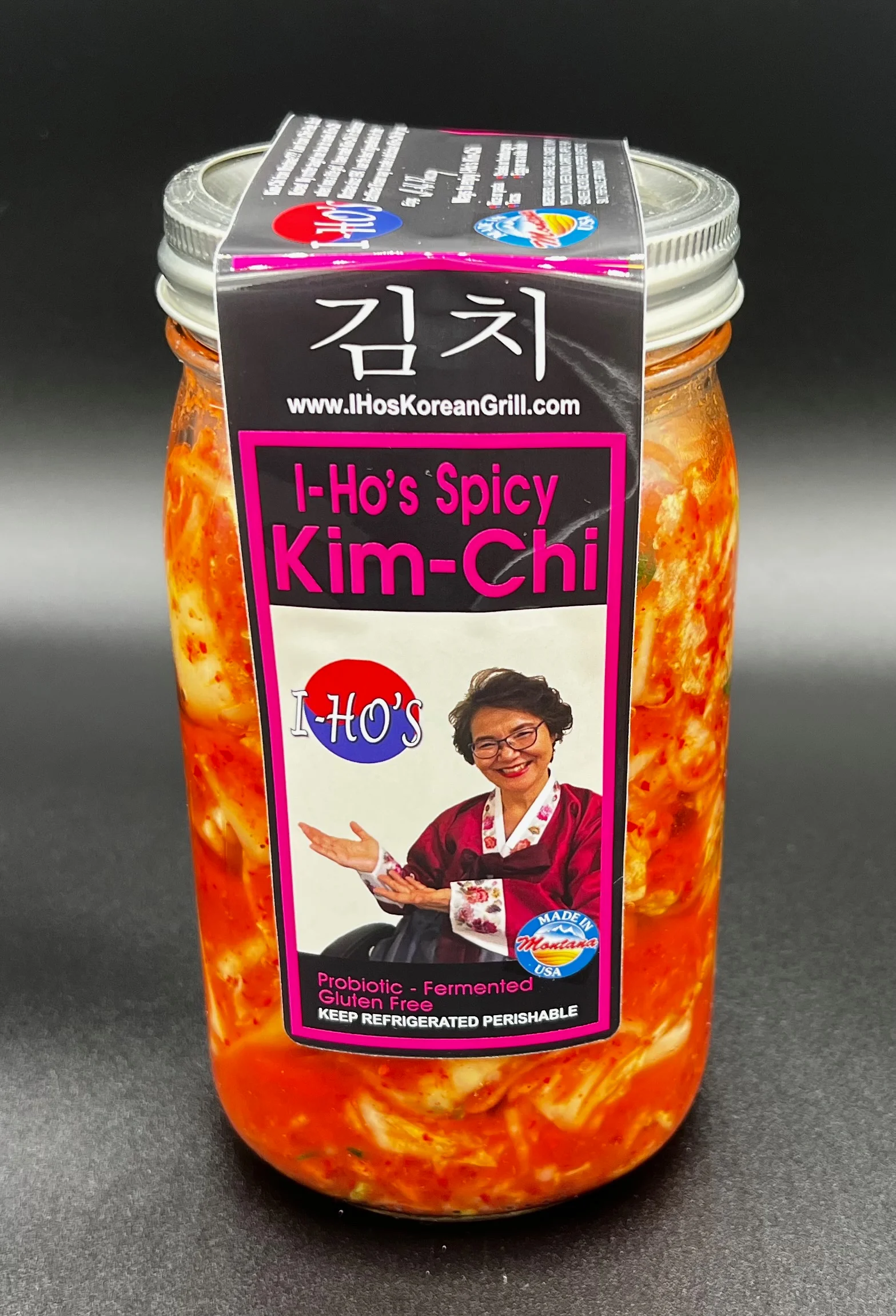 Jar of spicy Korean kimchi with Korean lettering on the label