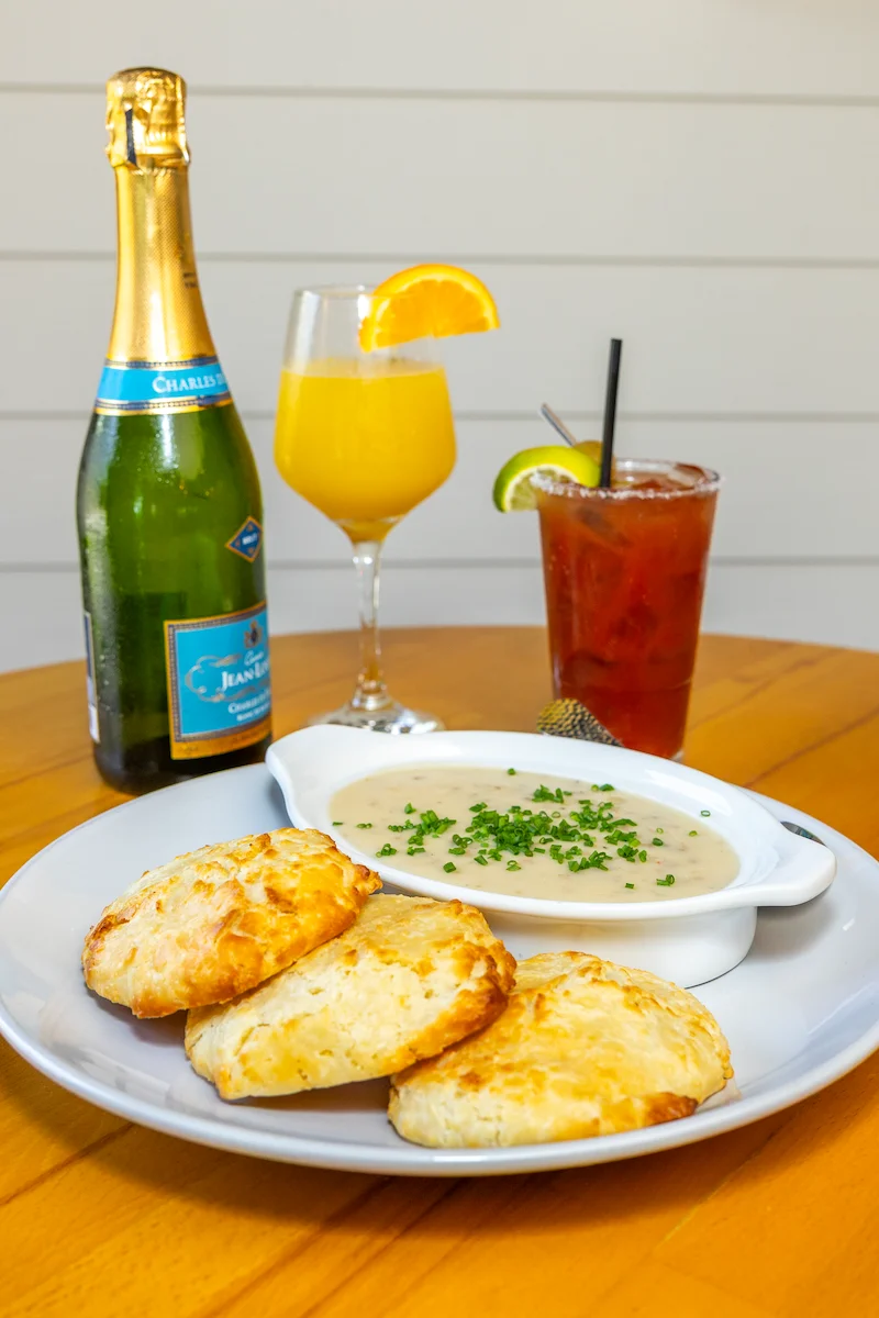 Table with brunch cocktails and biscuits and gravy