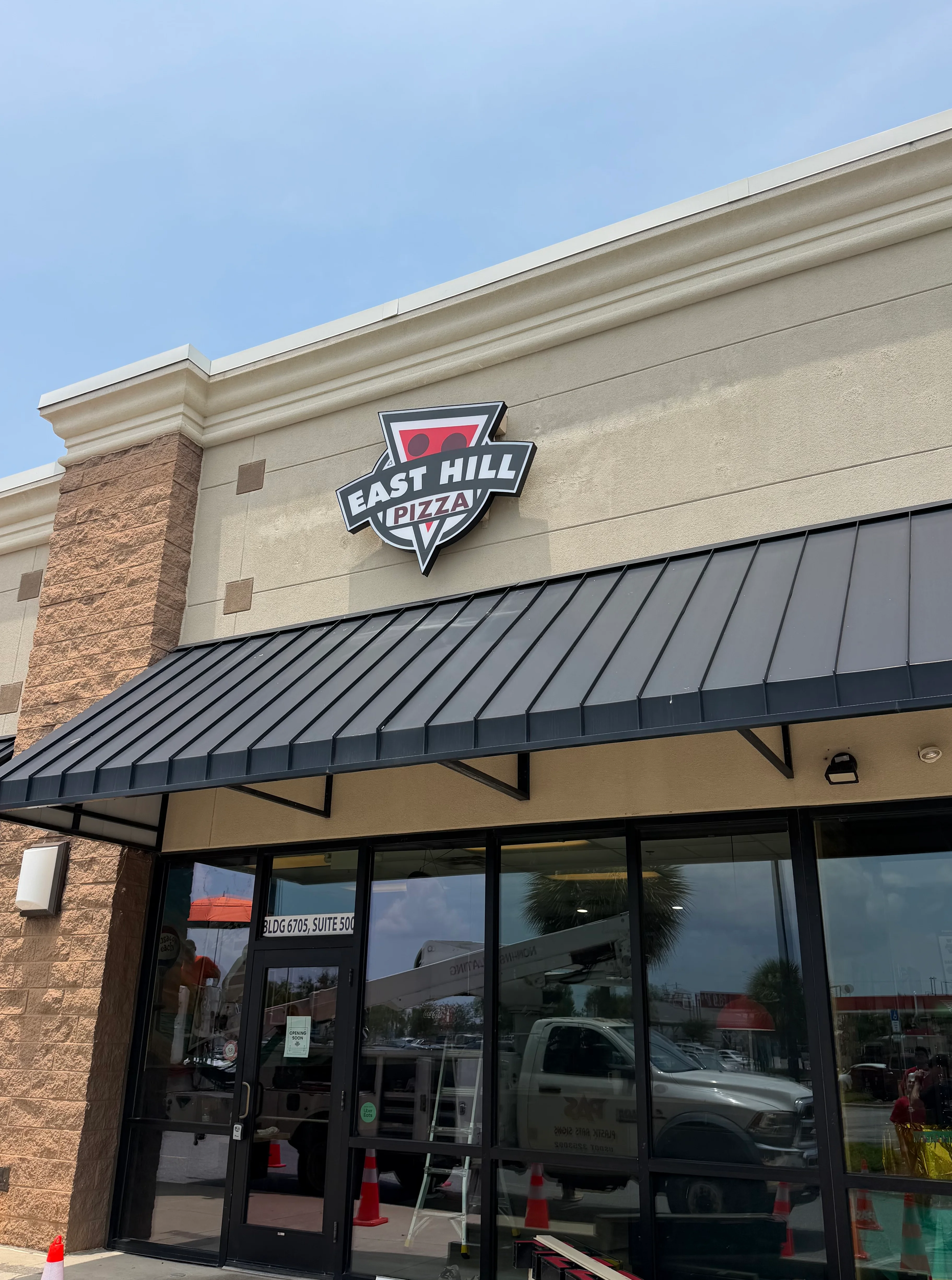 East Hill Pizza storefront with modern signage