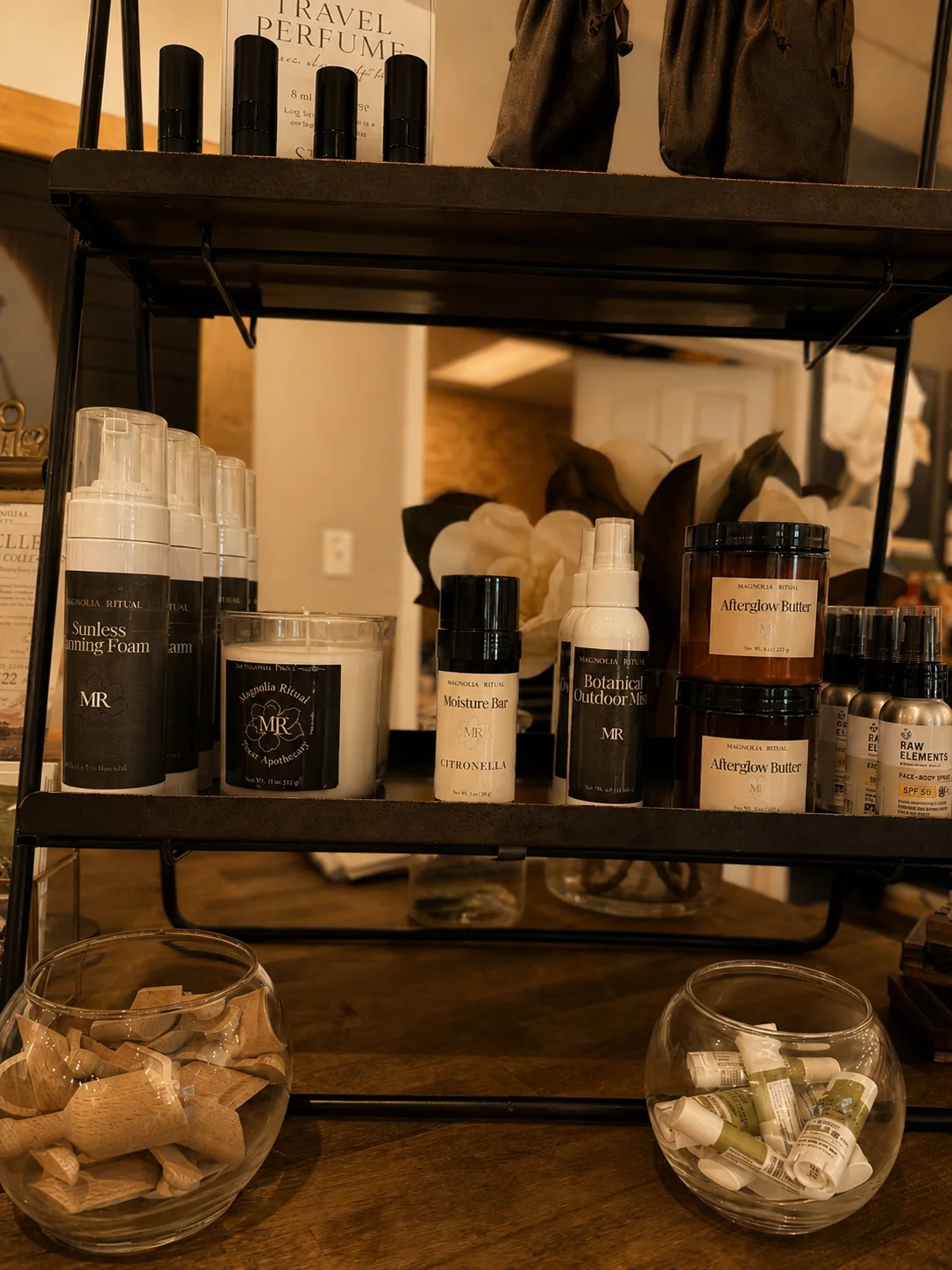Magnolia Ritual bath, body, and home fragrance collections displayed together.