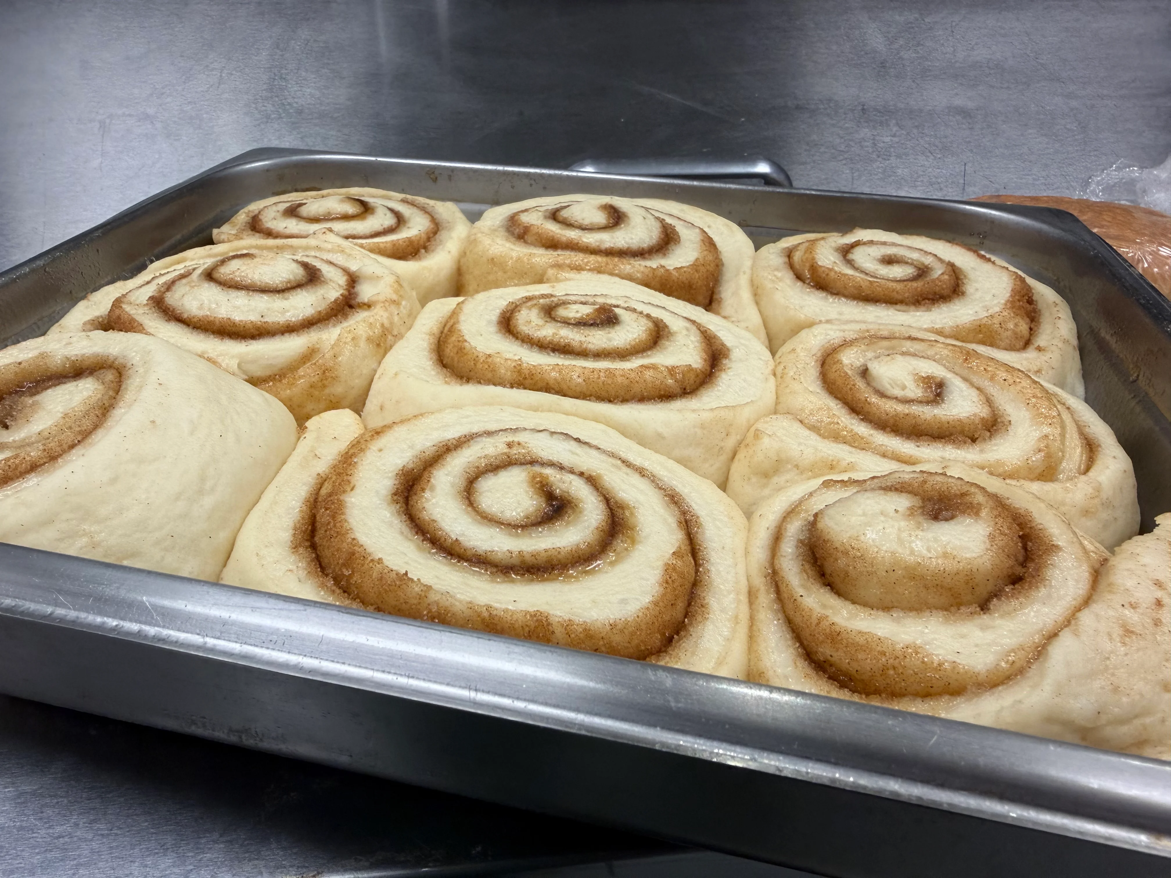 Freshly prepared cinnamon rolls ready for baking