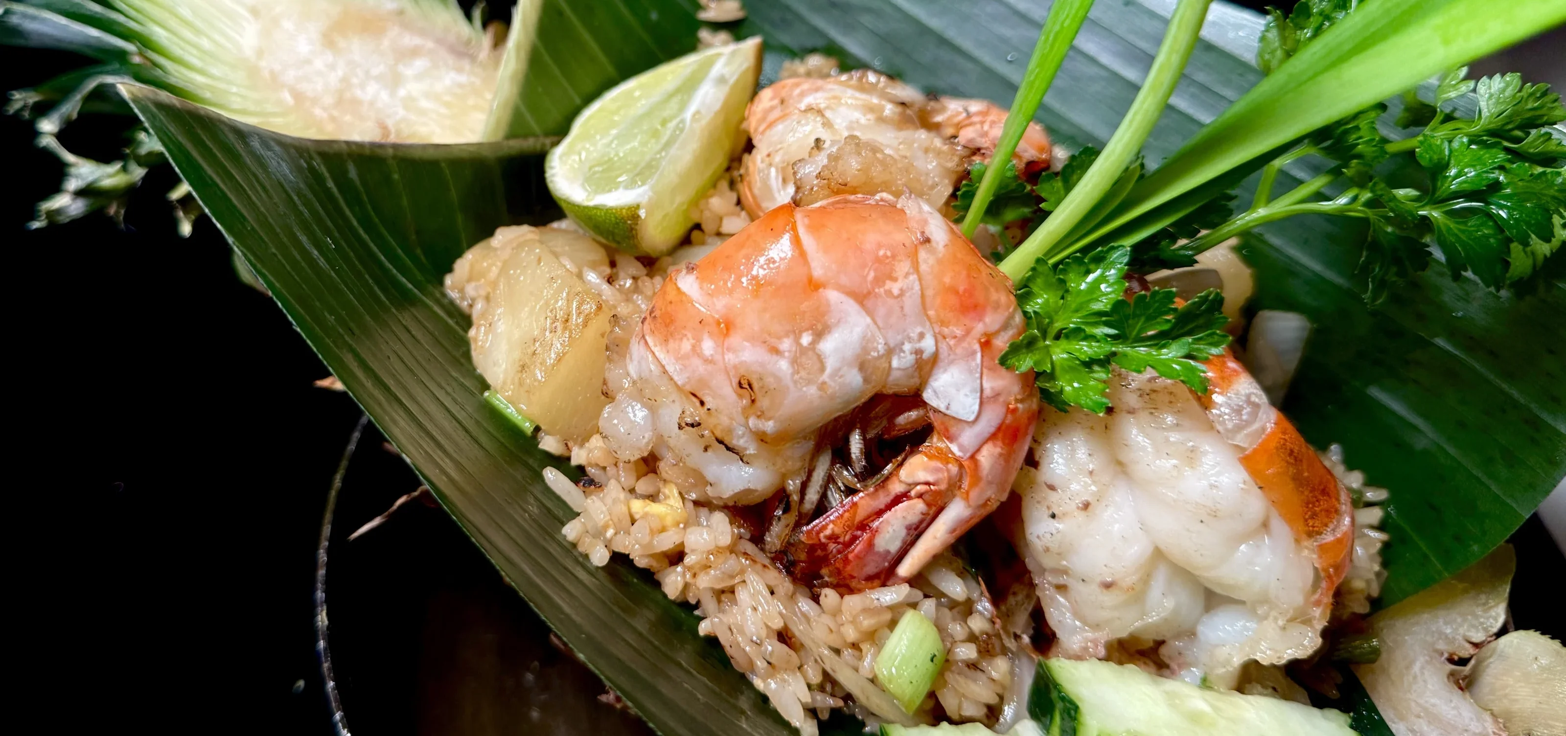 Thai shrimp fried rice served in a banana leaf