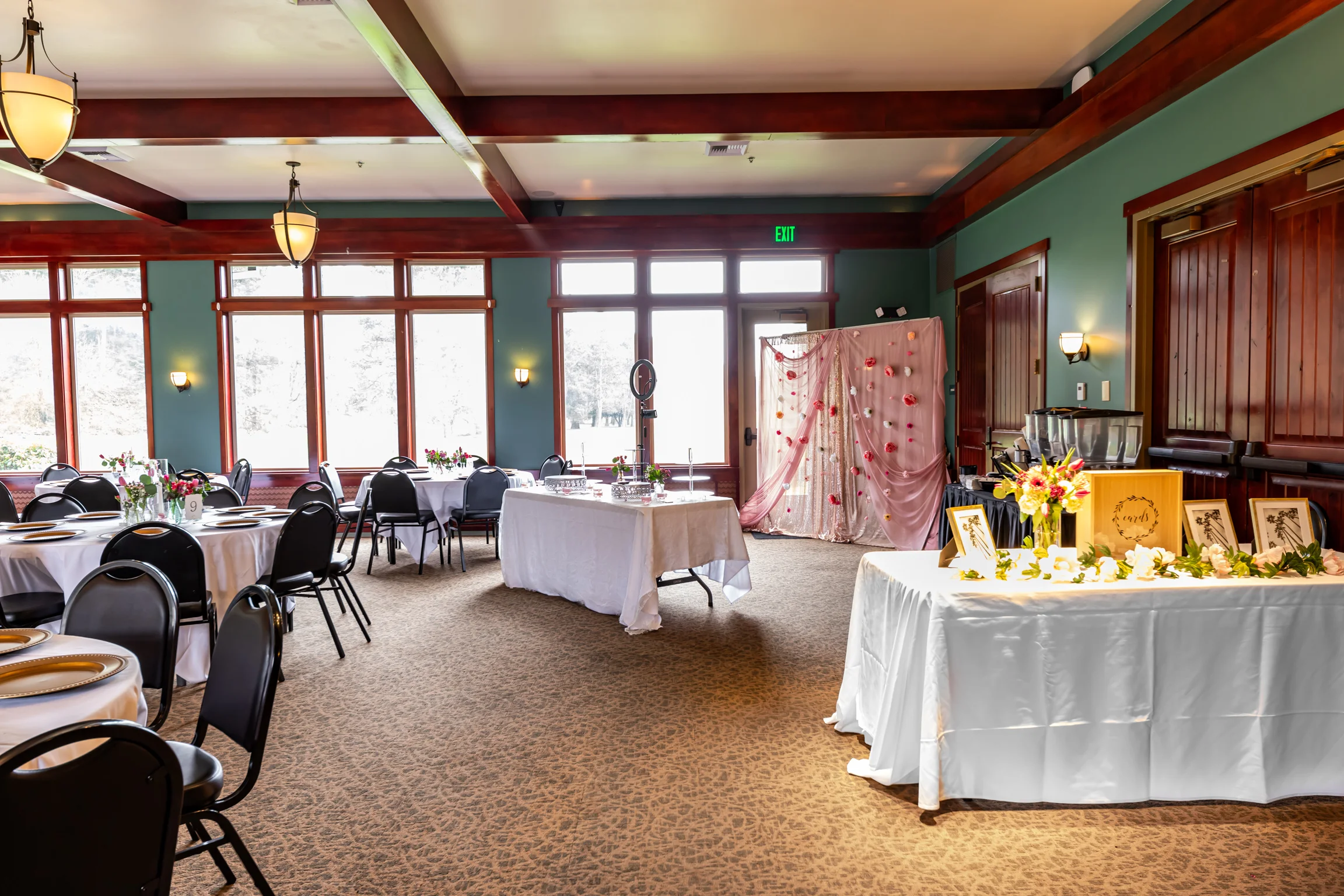 Elegant event space with tables and floral decor