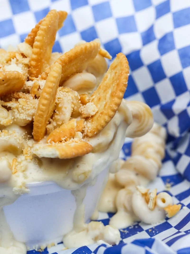 Creamy mac and cheese topped with crackers