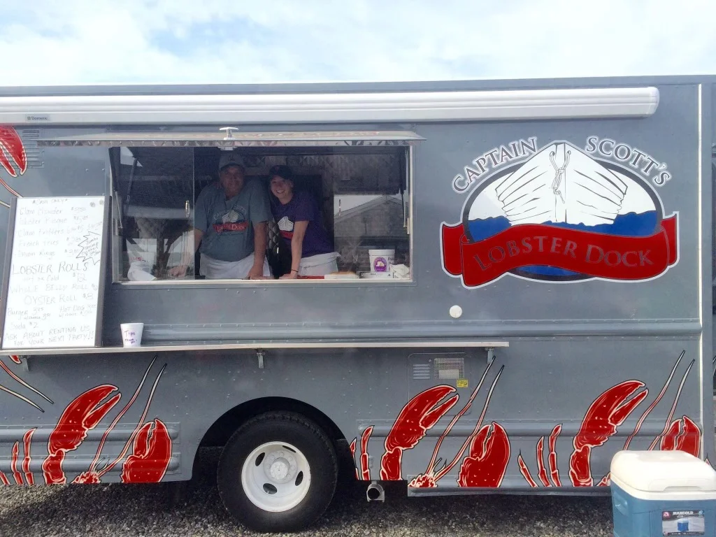 Food truck serving fresh lobster rolls by the seaside