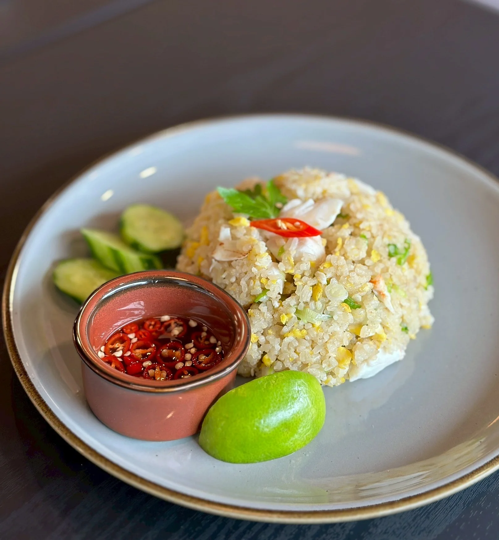 Thai fried rice served with lime and chili sauce