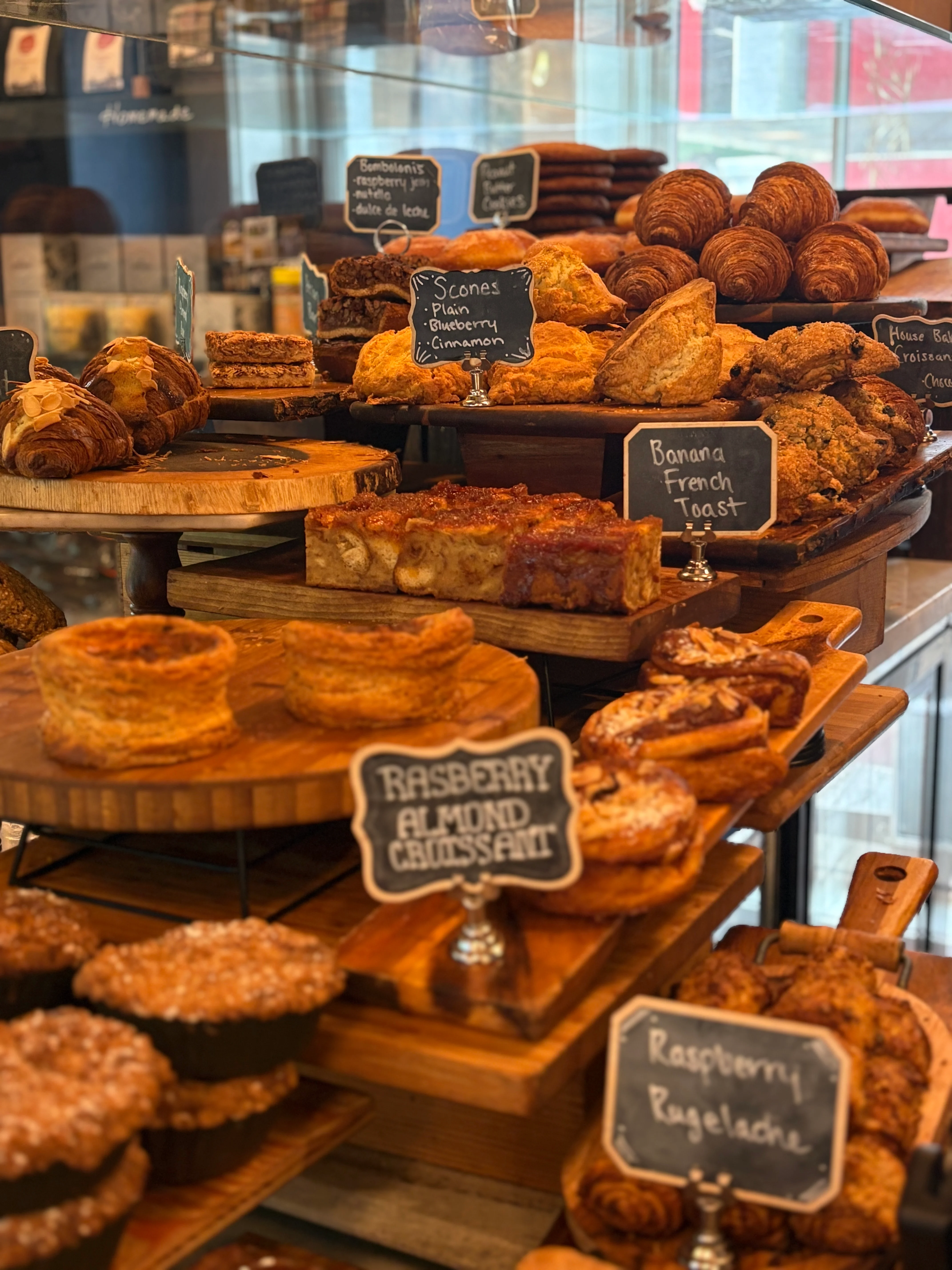 Assorted pastries including scones, croissants, and banana French toast
