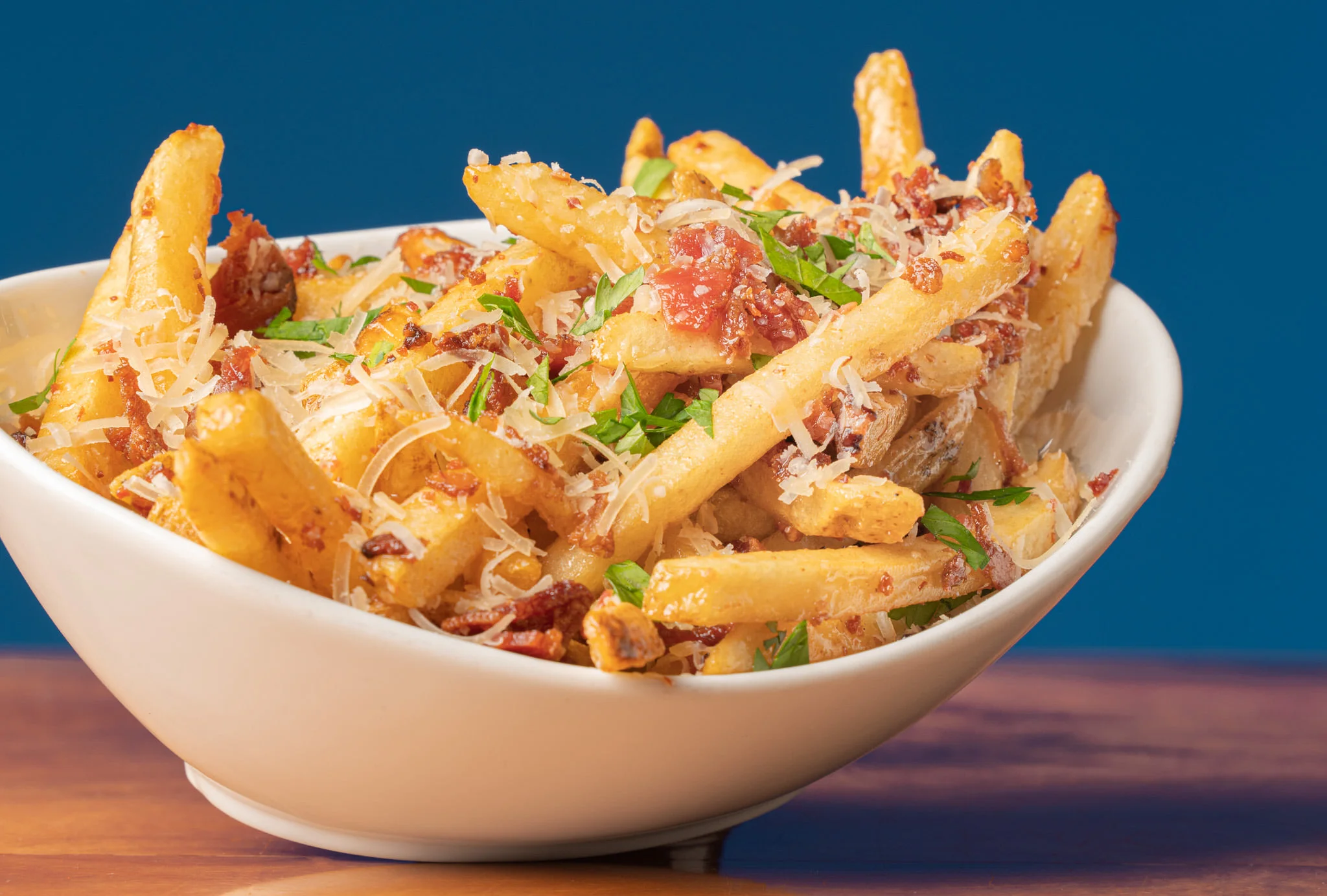 Loaded French fries topped with cheese and bacon