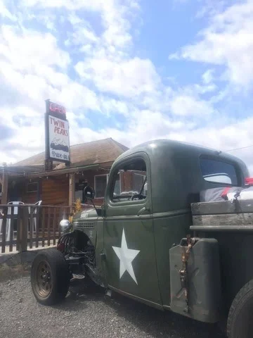 Vintage truck parked outside Twin Peaks restaurant