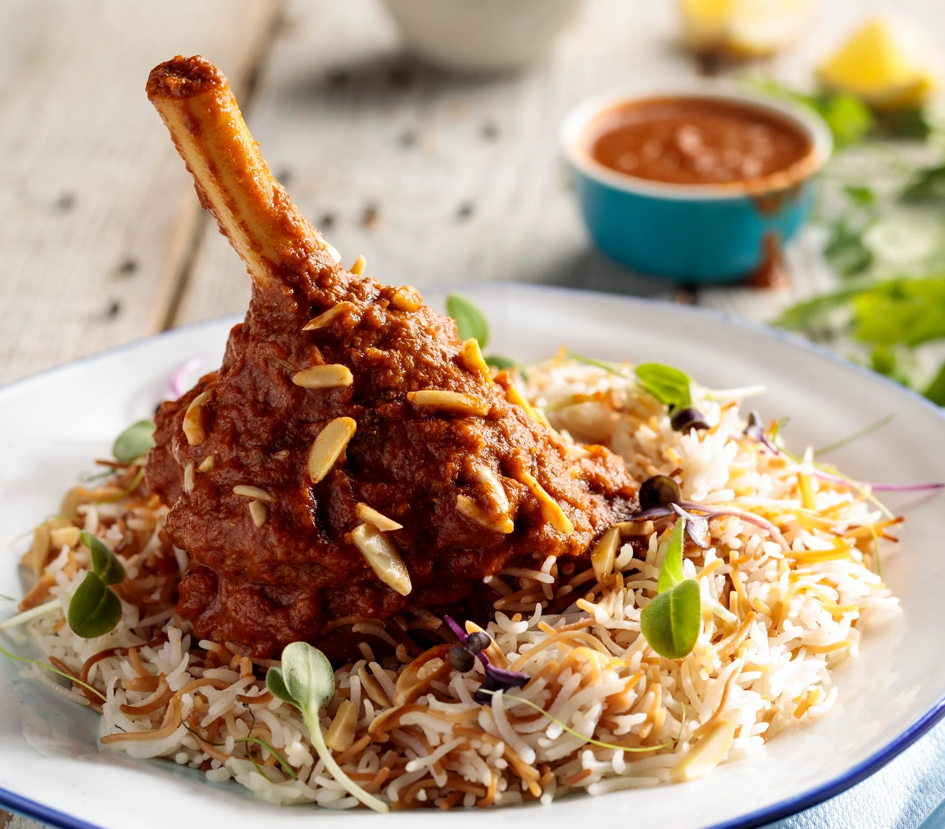 Lamb Shank Biryani served over rice at Castro Indian Restaurant & Bar