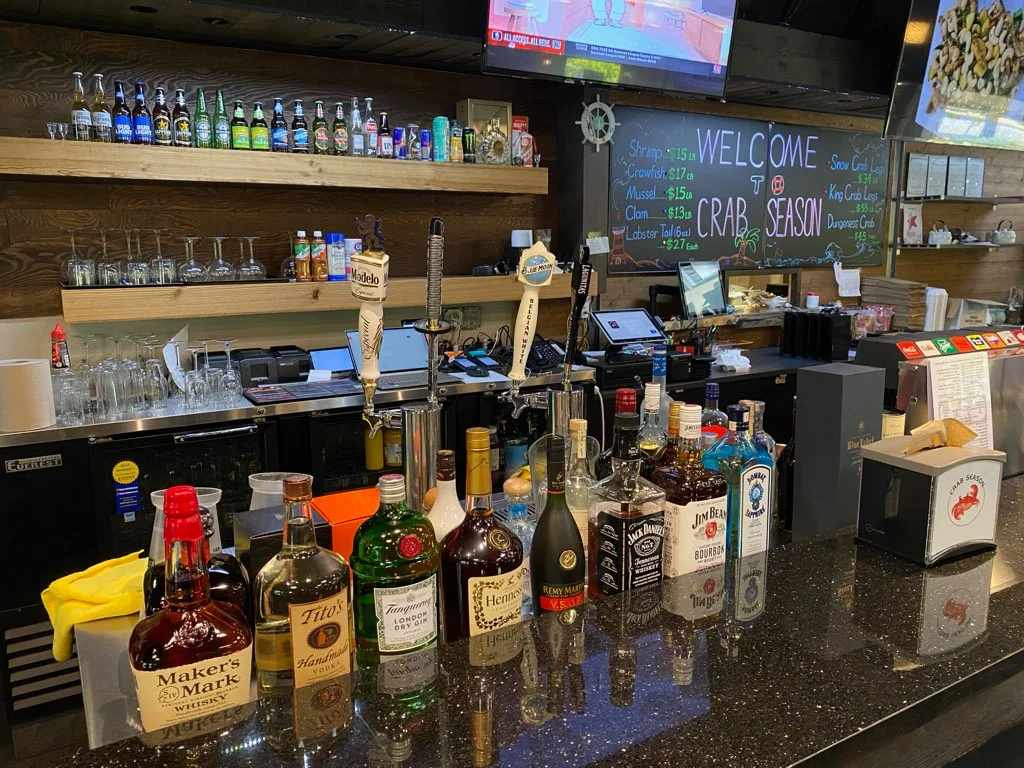 Modern bar counter with a variety of spirits and craft beer selection