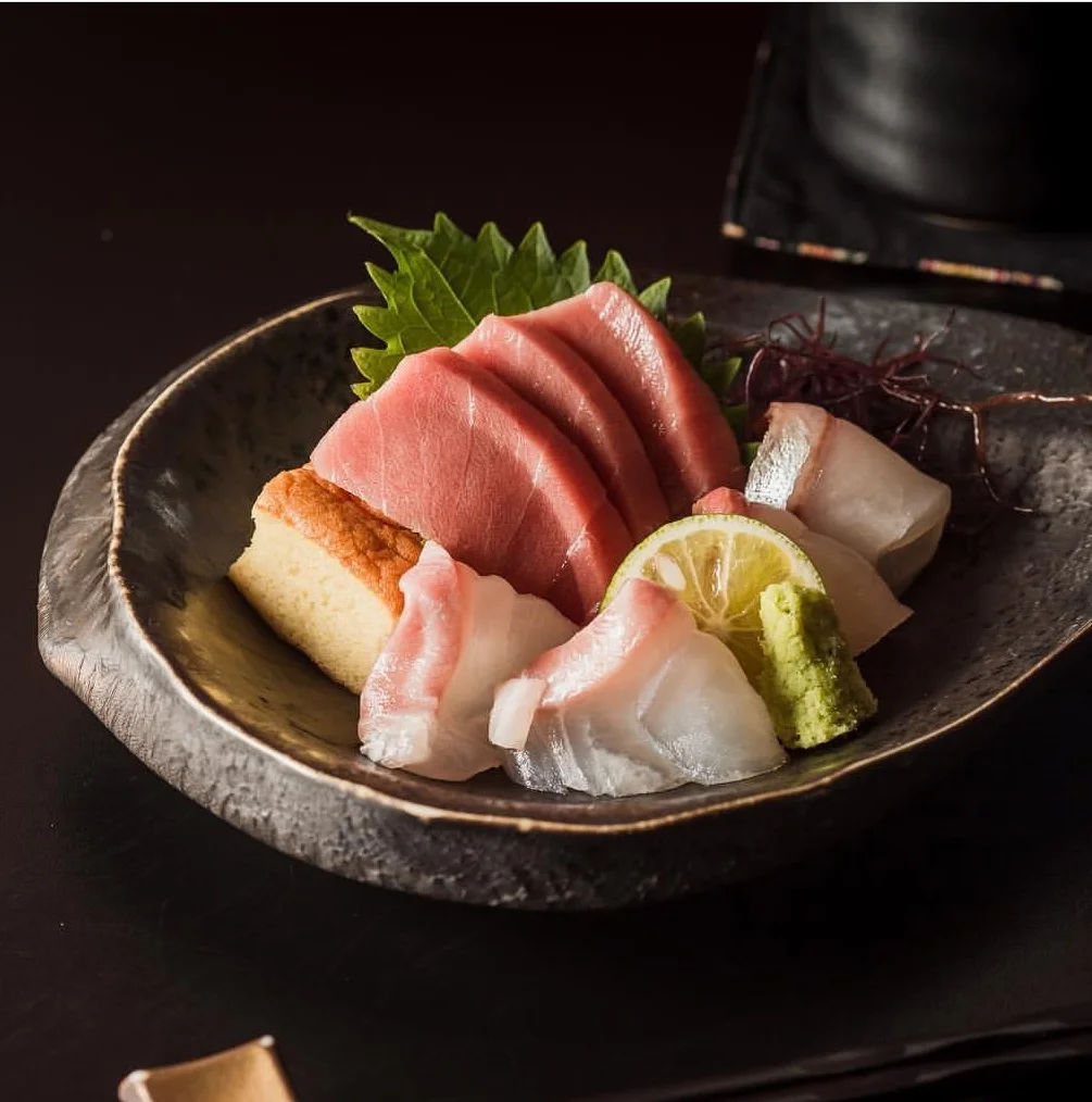 Sashimi platter featuring fresh tuna and white fish