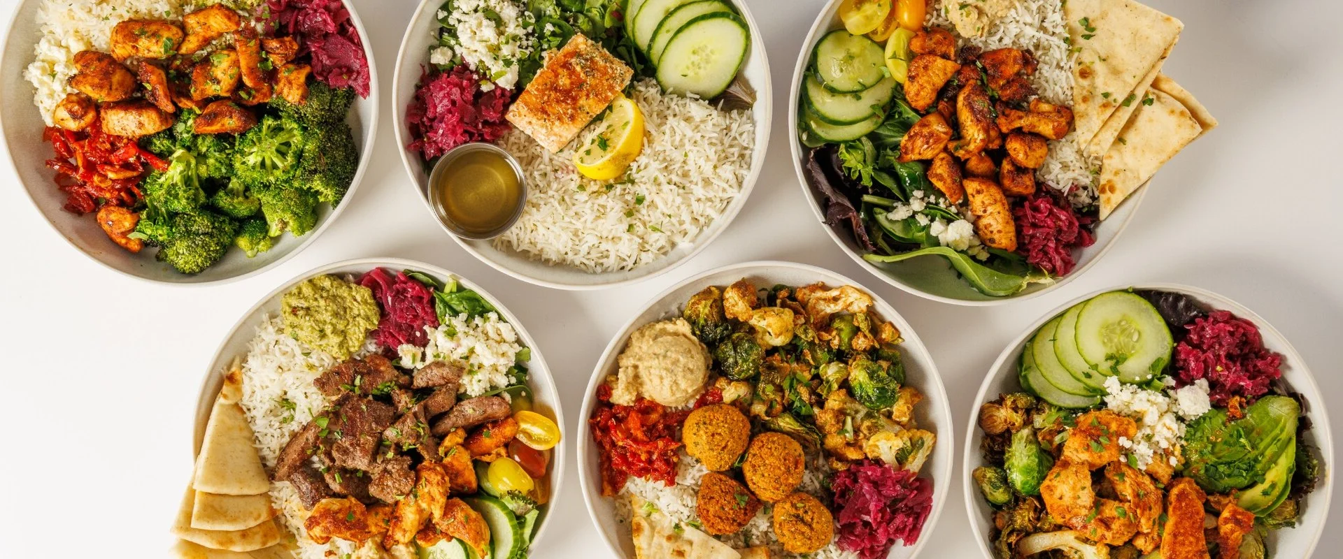 Variety of Mediterranean grain bowls and pasta dishes