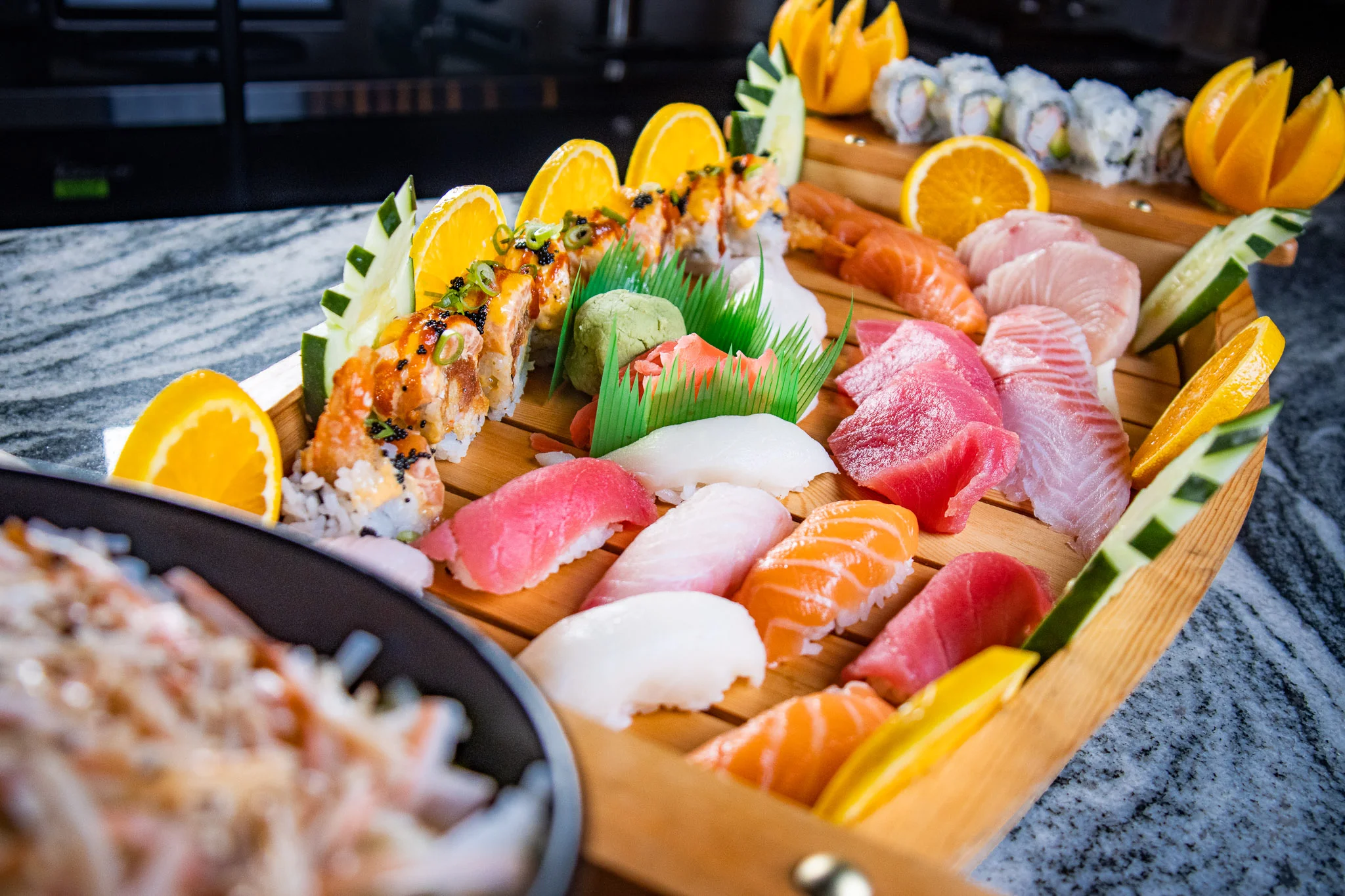 Assorted Japanese sushi platter with fresh fish and rolls