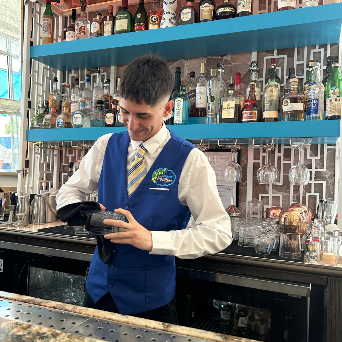 Bartender preparing a cocktail at a vibrant bar
