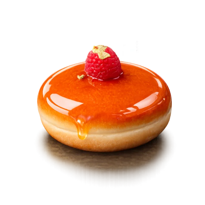 Crème Brûlée brioche donut with caramelized sugar topping, fresh raspberry, and edible gold flakes