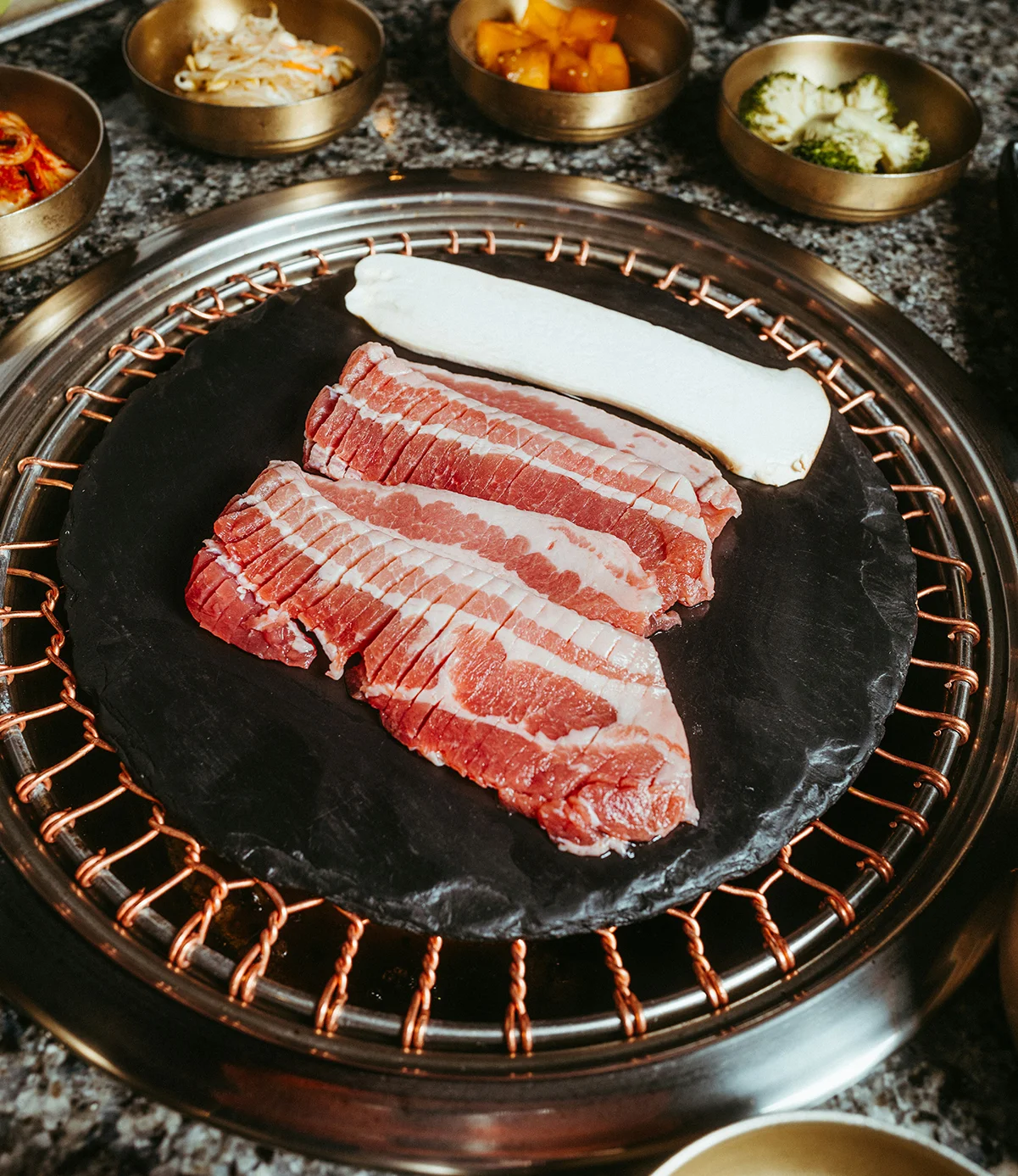 Korean barbecue with marbled beef on a grill