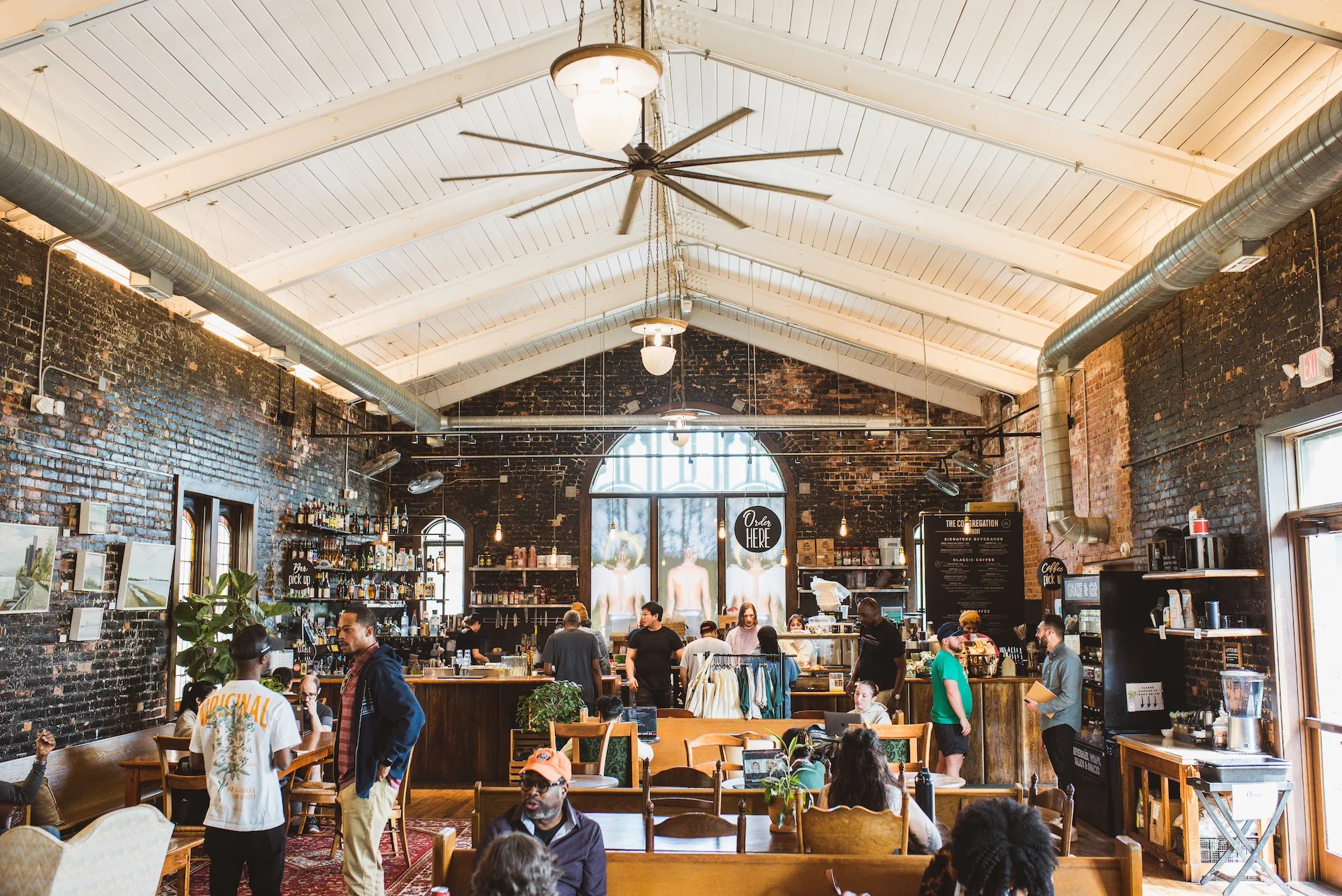 Cozy restaurant interior with exposed brick and high ceilings